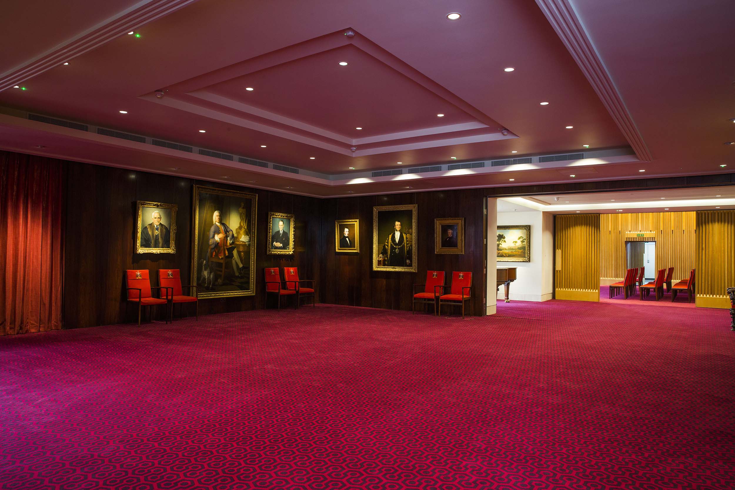 Elegant Court Room in Salters' Hall with red carpet, ideal for meetings and events.