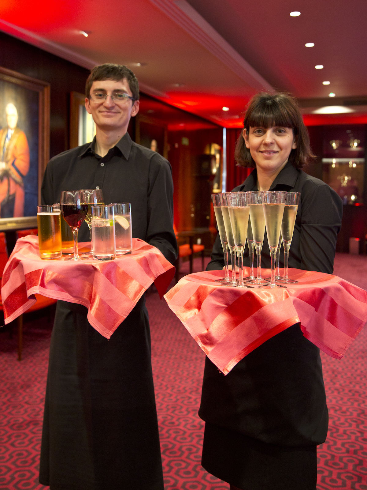 Event setting in The Court Room, Salters' Hall with attentive staff and warm lighting.