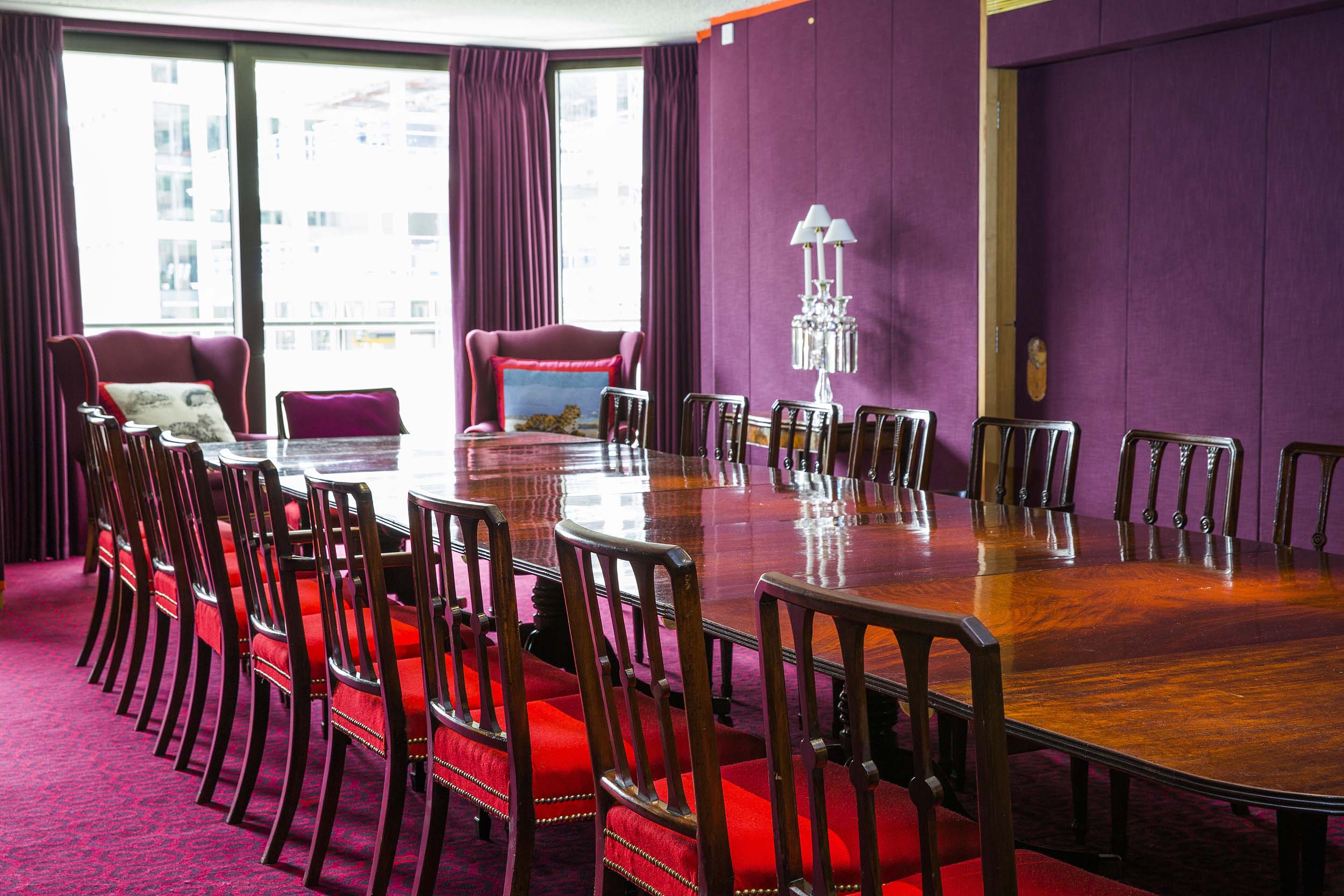 Elegant meeting room with polished table, ideal for discussions and events.