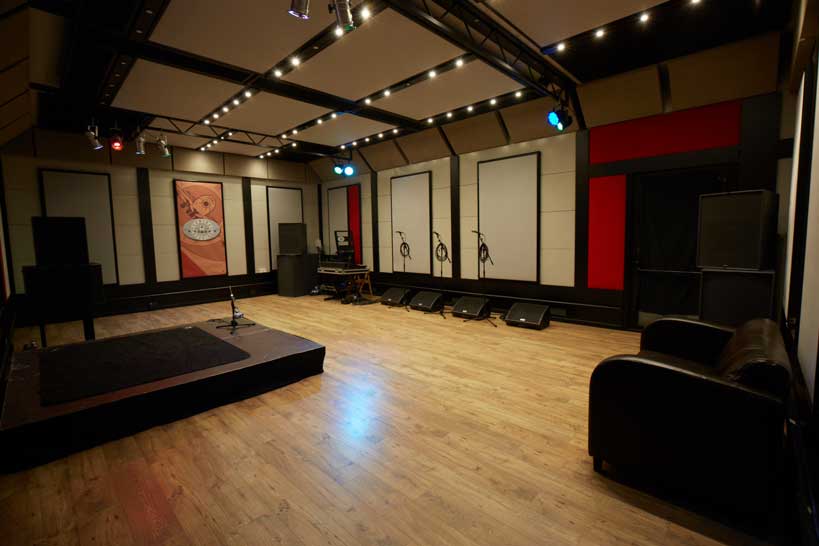 Rehearsal studio in London with acoustic panels for live performances and workshops.
