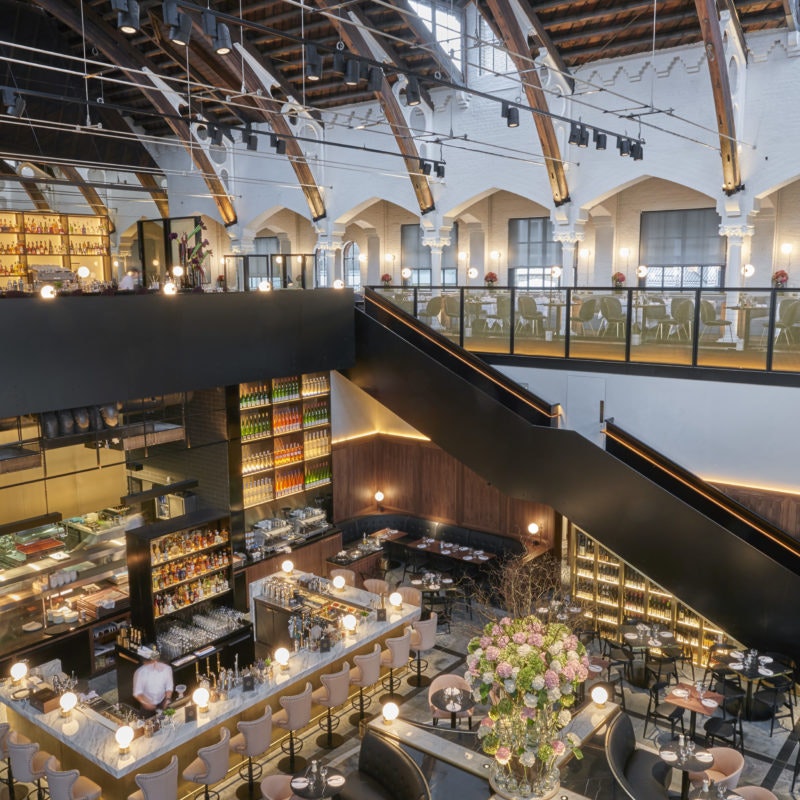 Sophisticated Grand Café event space with high ceilings for corporate and social gatherings.