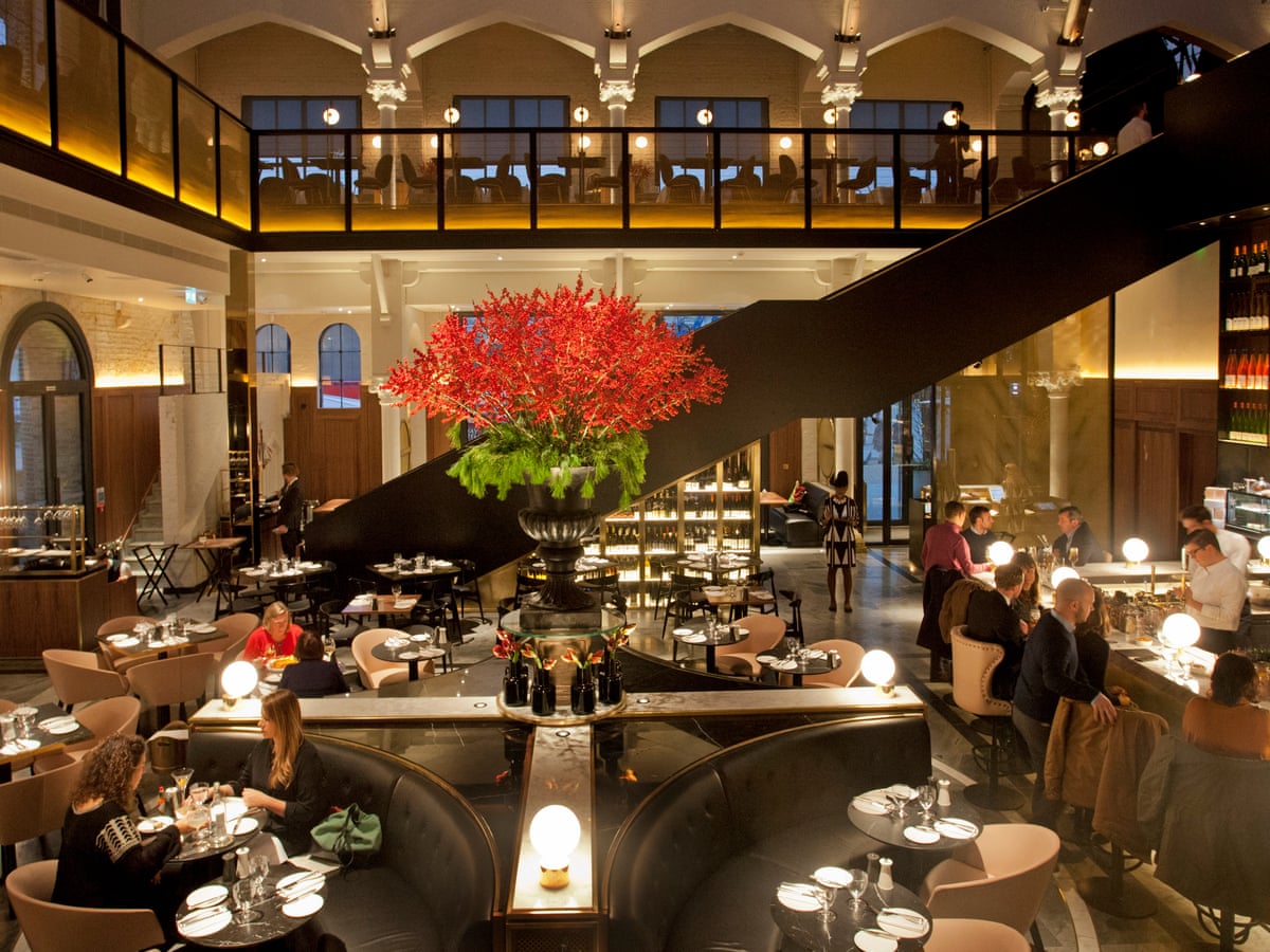 Elegant dining at Grand Café, featuring floral centerpiece – perfect for upscale events.