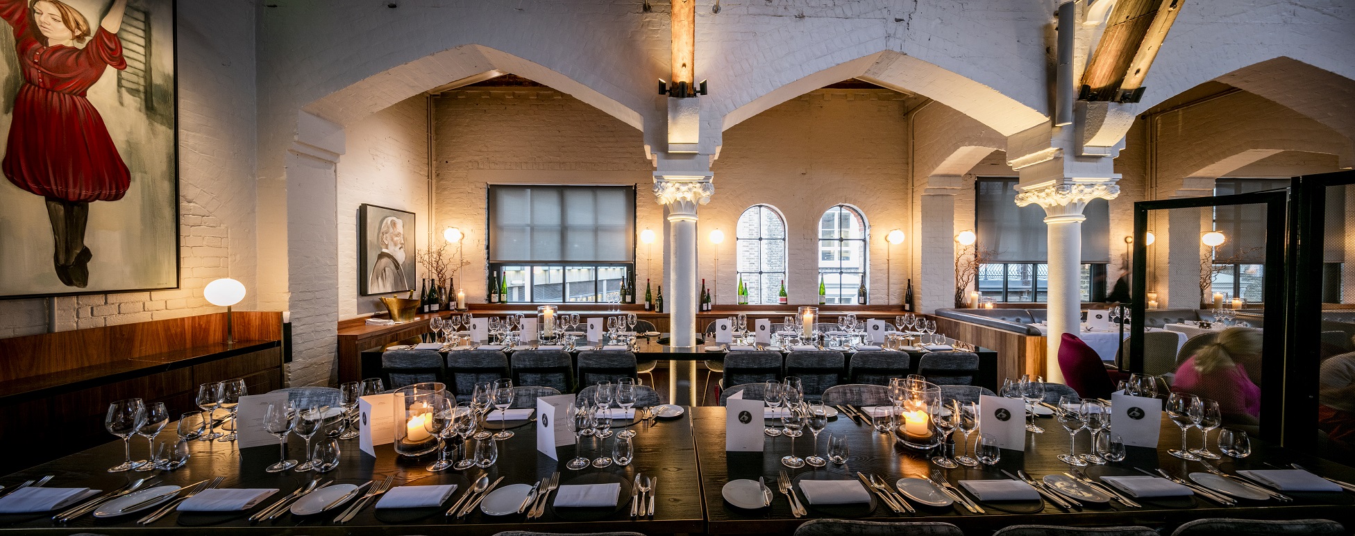 Semi-private dining room at German Gymnasium, ideal for upscale corporate events.