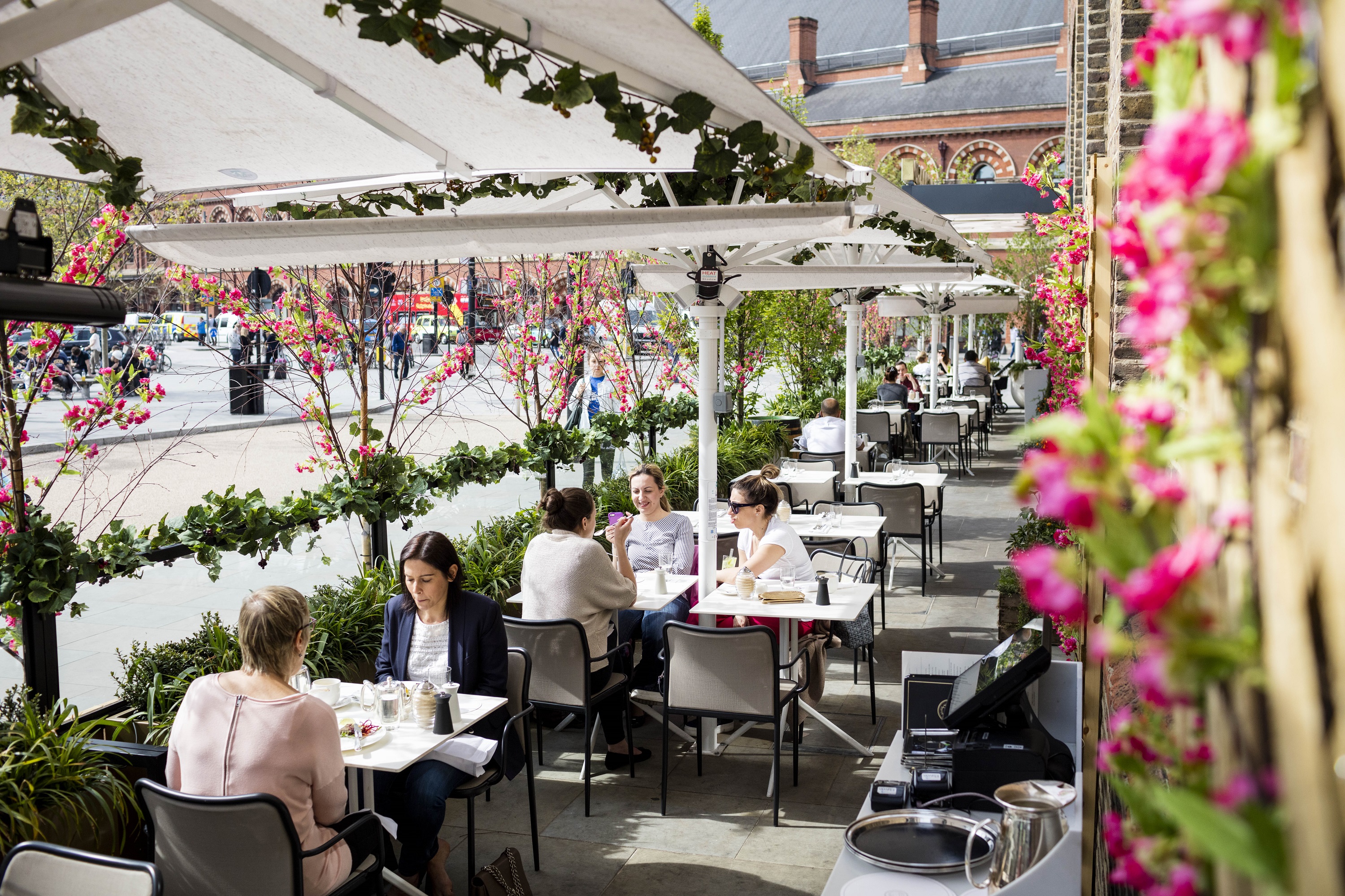 Vibrant outdoor dining area at German Gymnasium, ideal for casual meetings and networking events.
