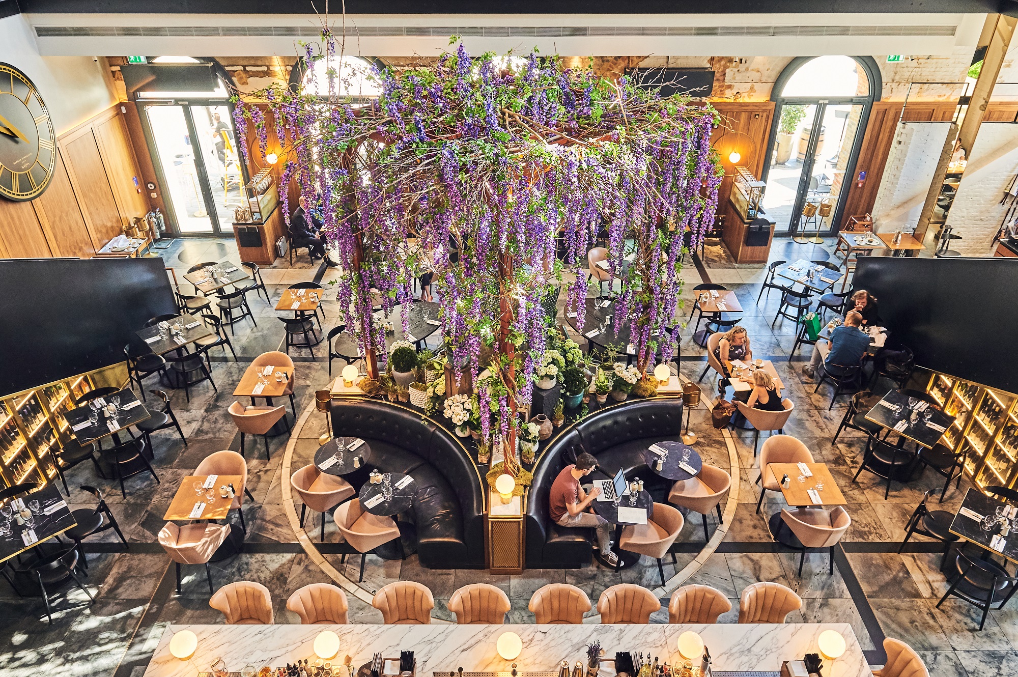 Elegant venue with floral decor for upscale events and receptions in German Gymnasium.