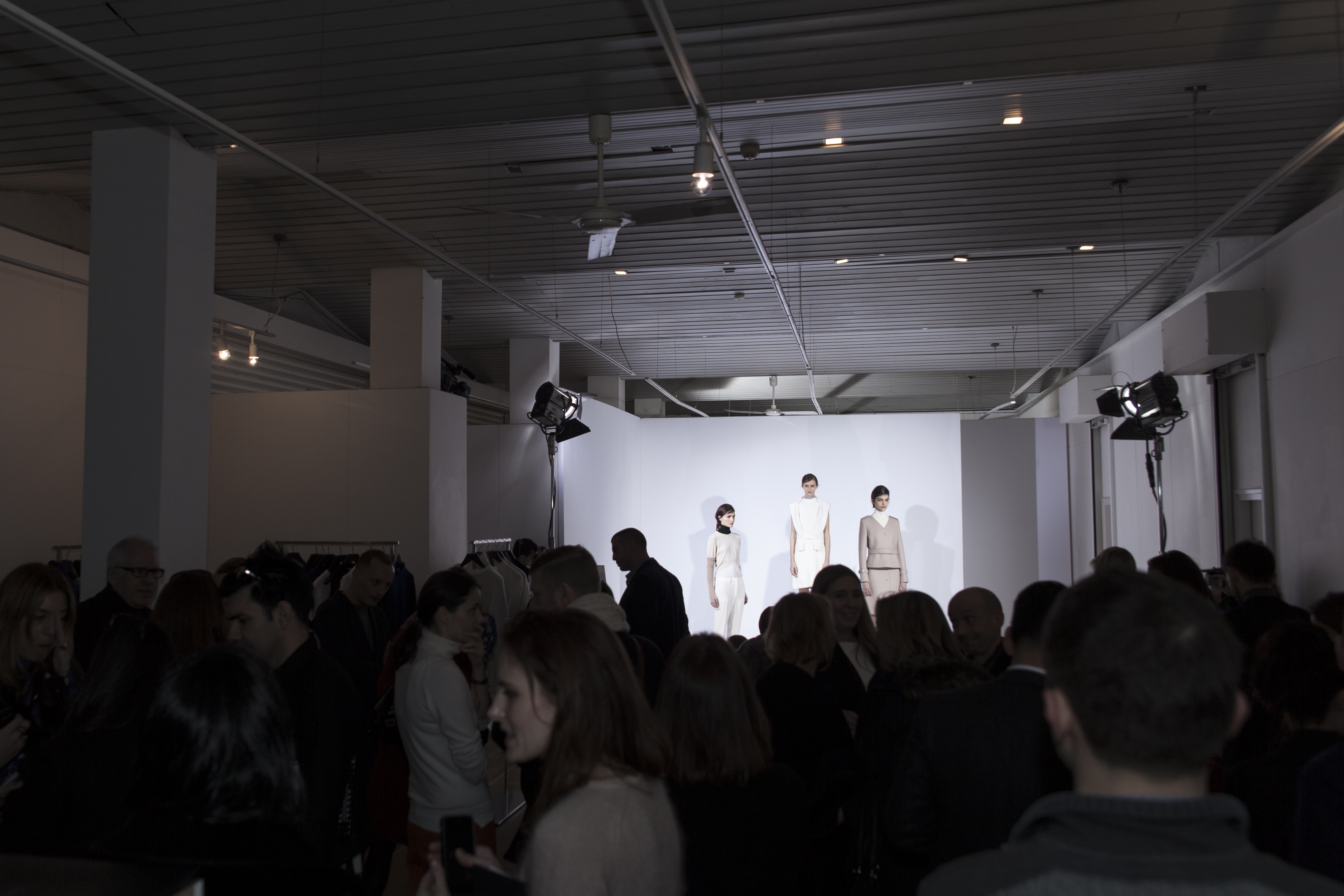 "Fashion presentation at Bankside Gallery with models and engaged attendees in elegant venue."