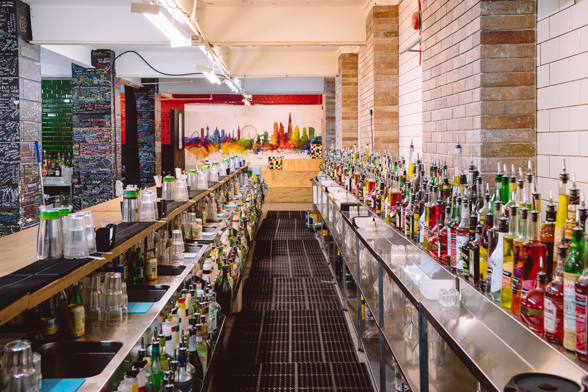 Vibrant bar setup at London Bartender School for lively events and networking.