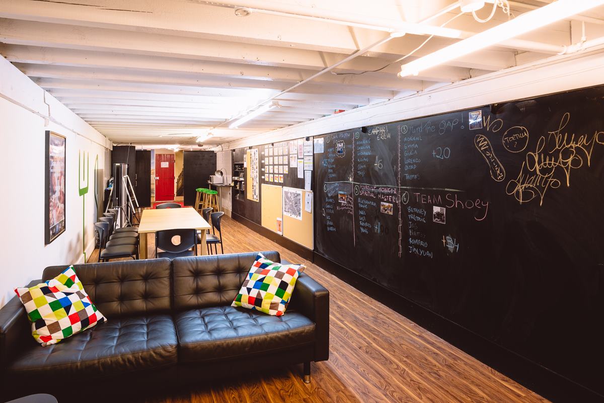 Chill Out Room at London Bartender School, featuring black chalkboard walls for workshops.