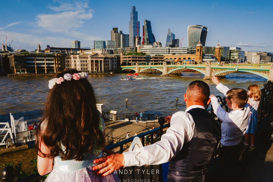 Outdoor wedding in The Balcony Room, riverside view, vibrant atmosphere, city skyline.