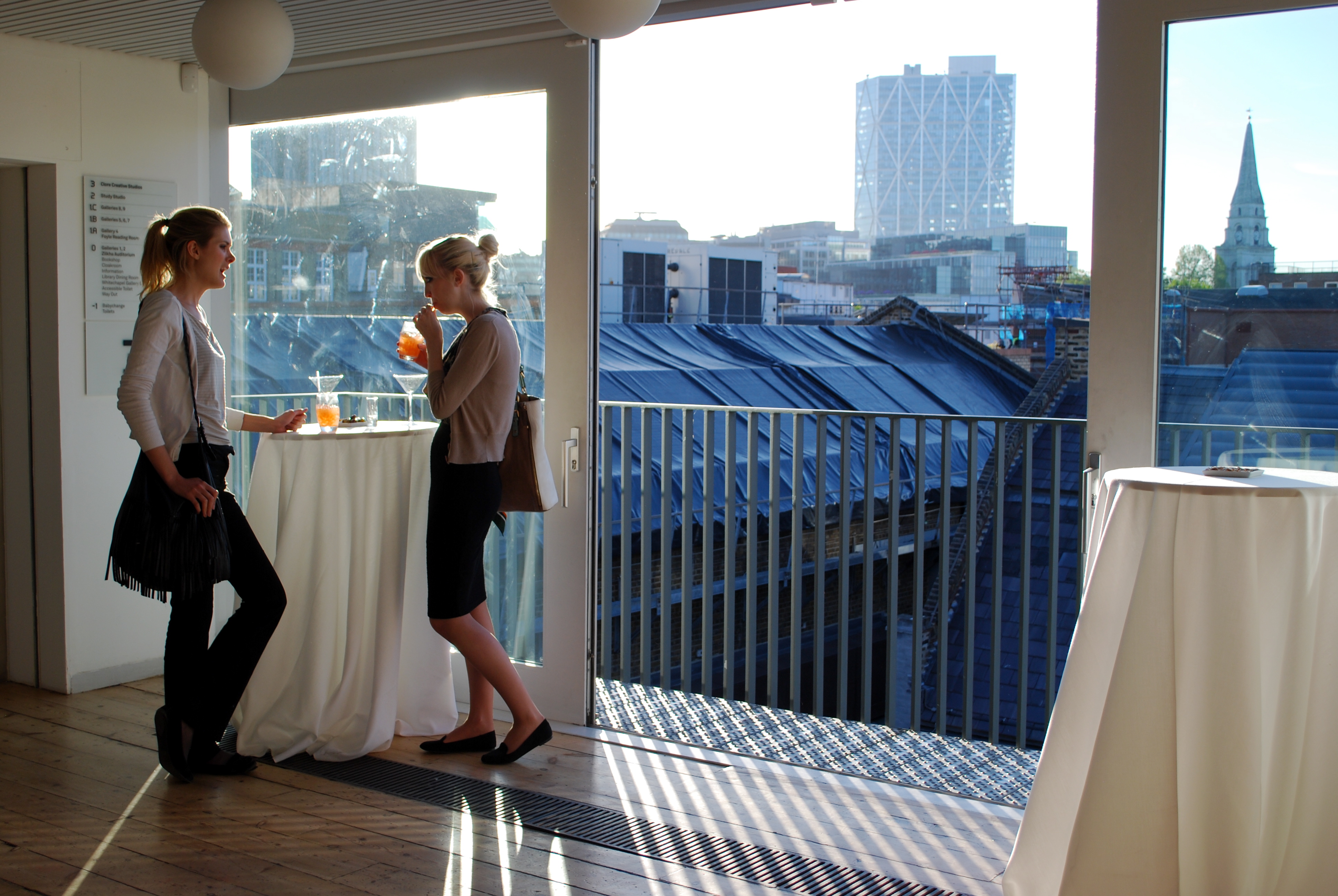 Stylish networking event at Whitechapel Gallery with city view and natural light.