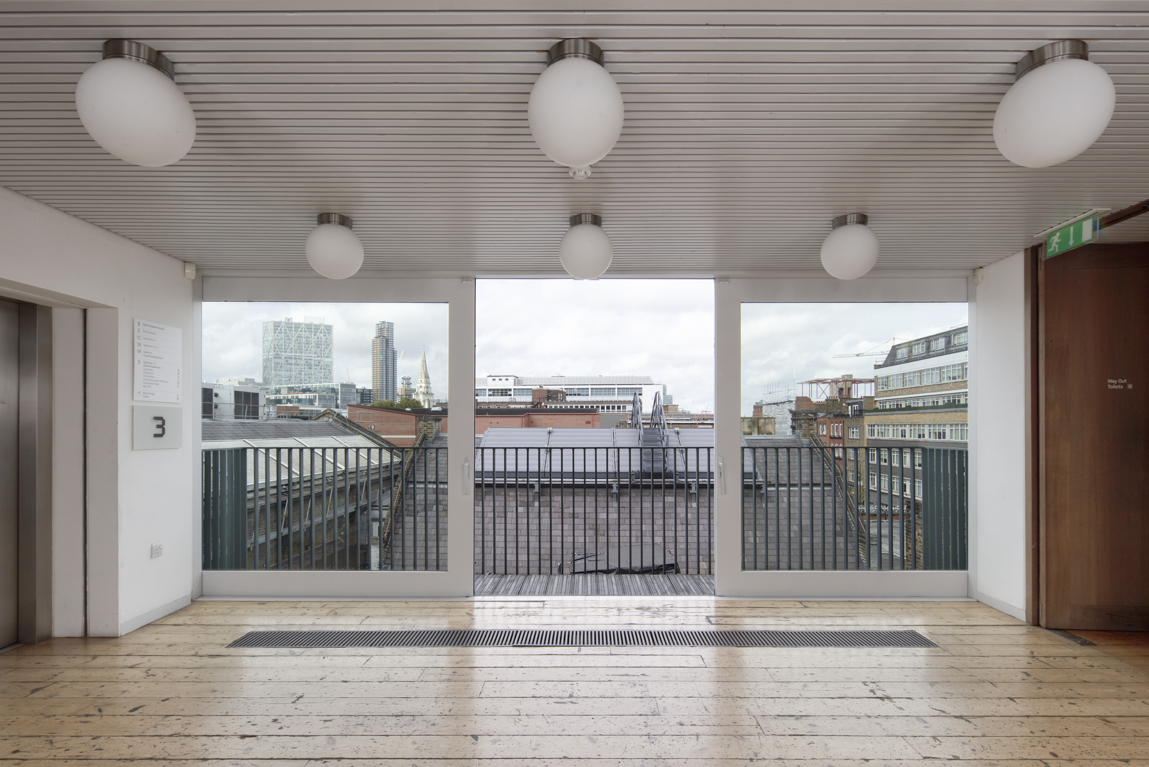 Modern event space in Whitechapel Gallery with city skyline views, ideal for workshops.