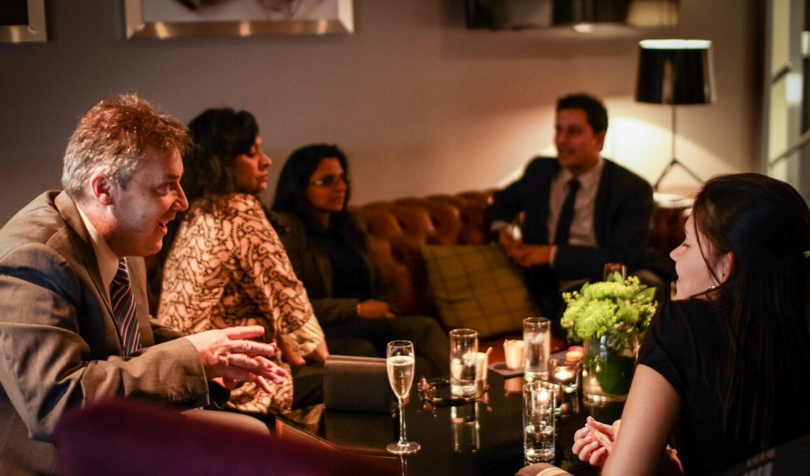 Lounge in SpitfireHouse: upscale networking event with elegant decor and drinks.