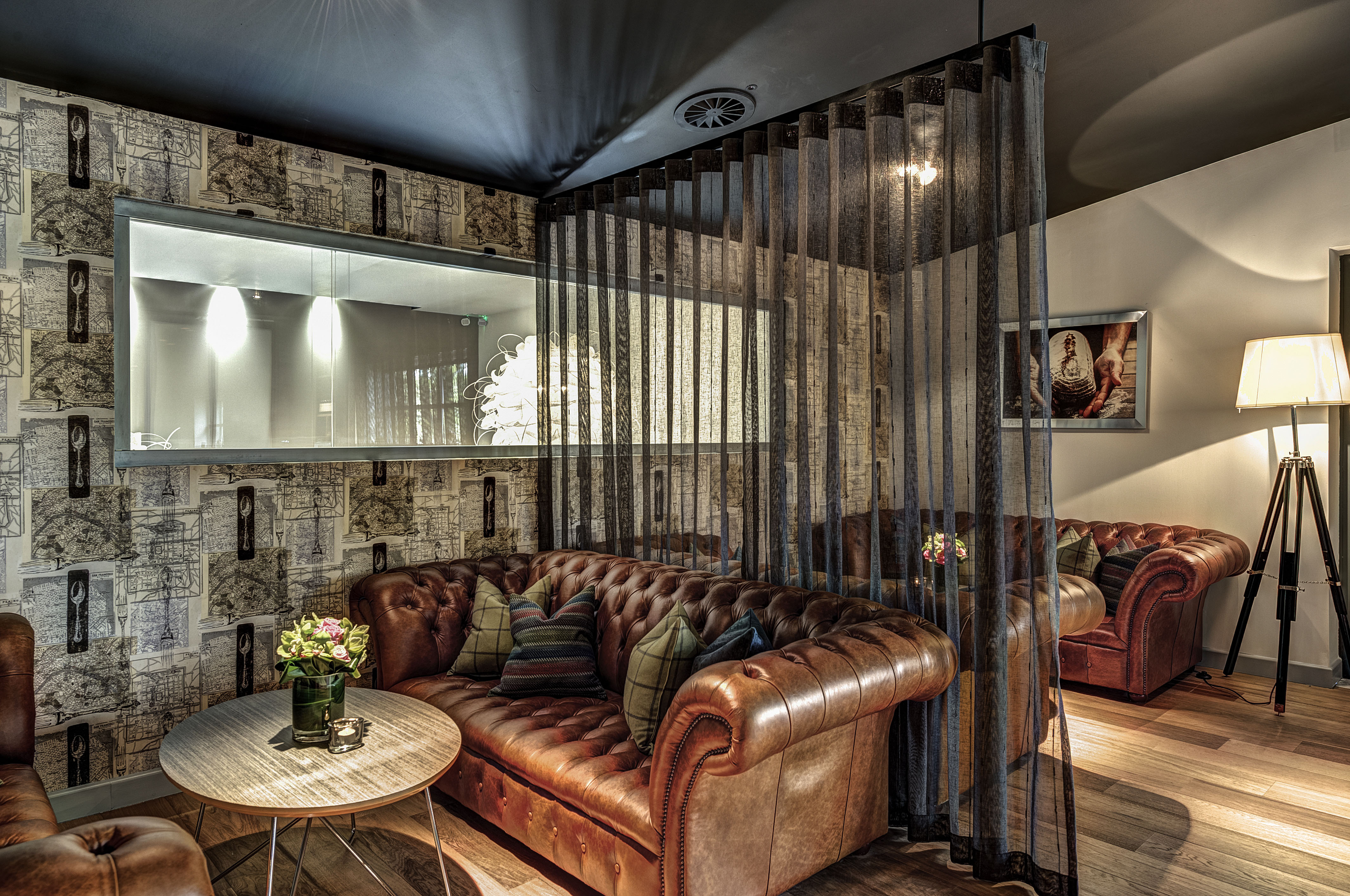Stylish lounge with leather seating, ideal for networking events and informal meetings.
