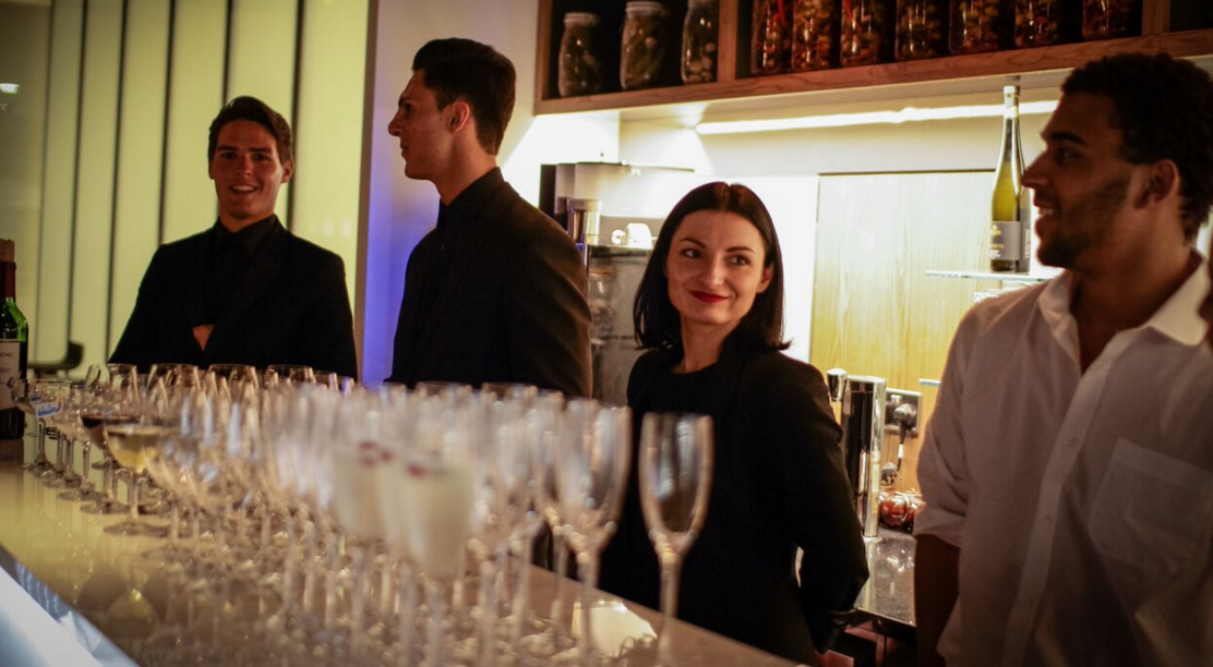Lounge staff at SpitfireHouse bar, ready for exceptional event service.