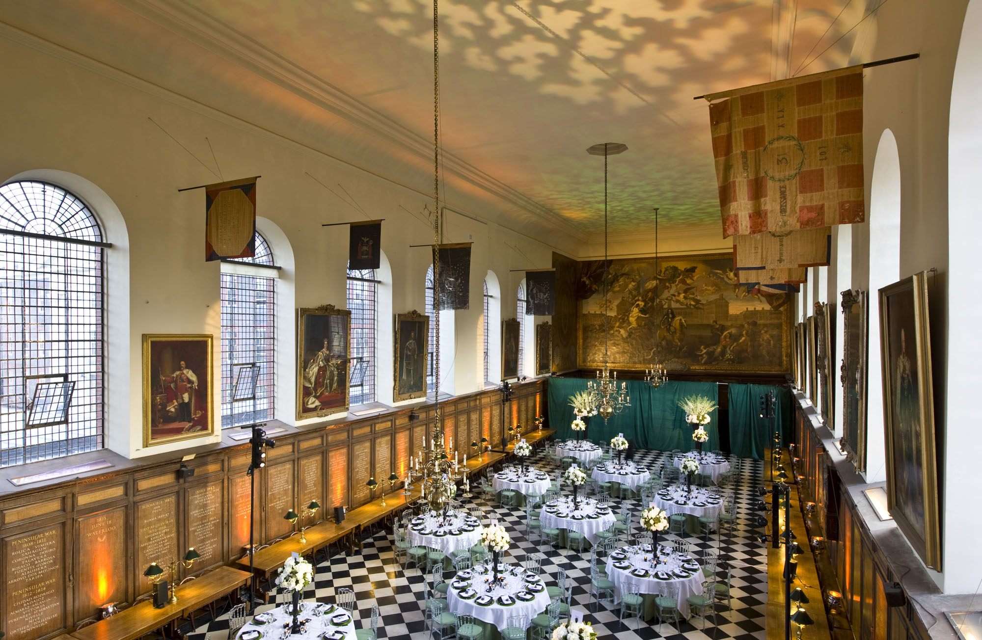 Elegant round tables in The Great Hall, Royal Hospital Chelsea for upscale events.