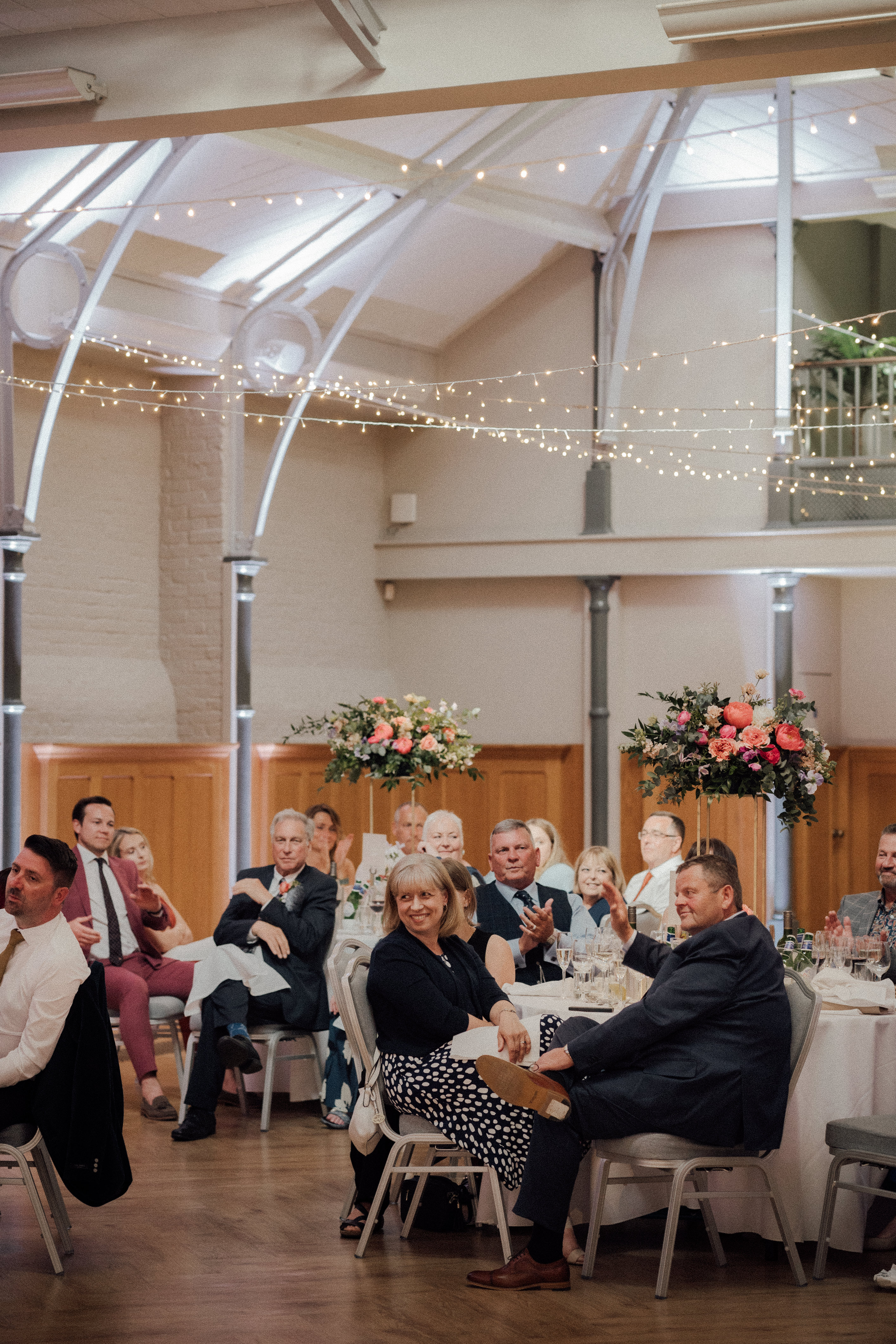 Elegant Prince Consort Rooms event with floral centerpieces and engaged guests.