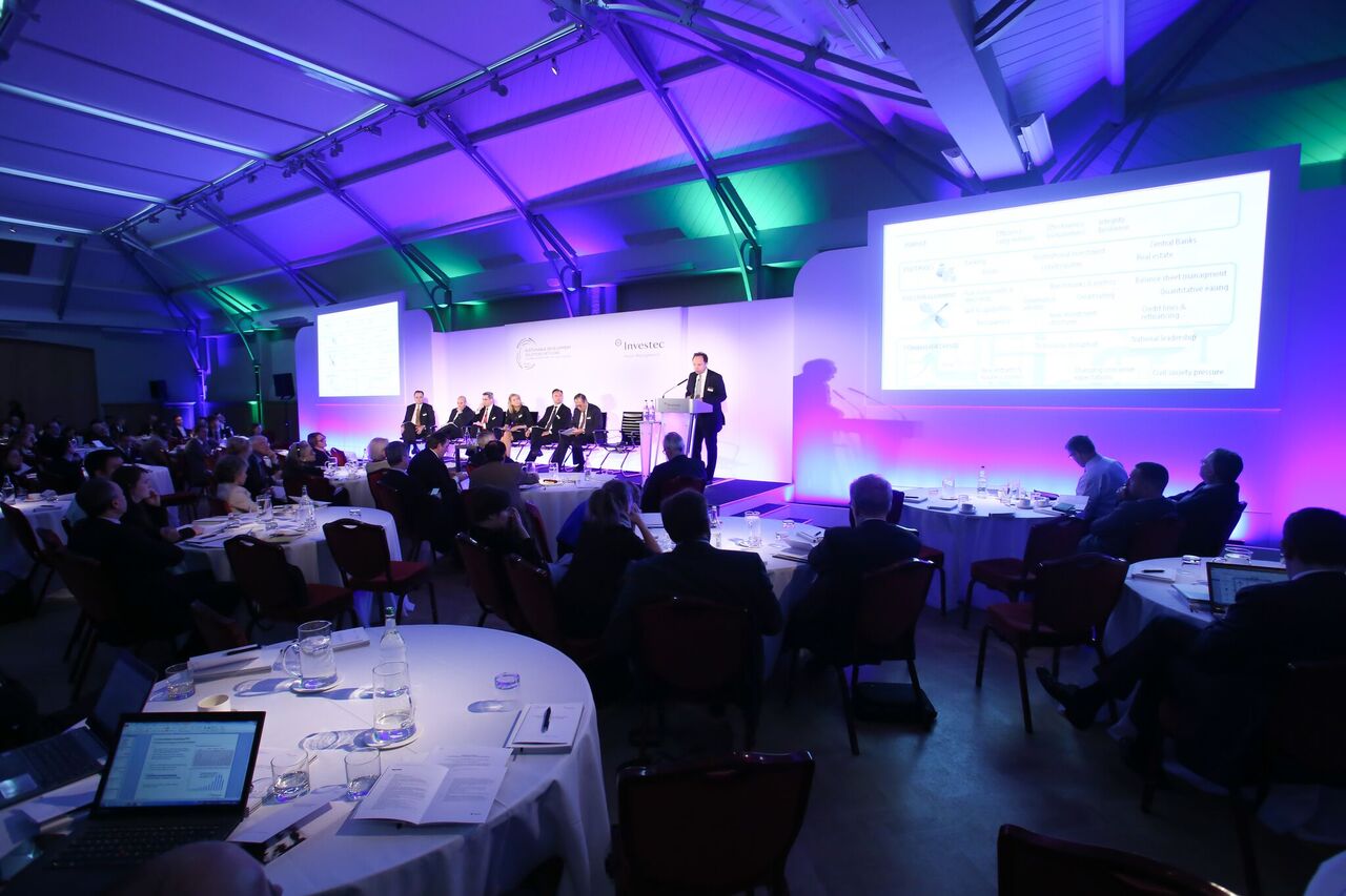 Conference setup at HAC with speaker addressing engaged audience, showcasing event professionalism.