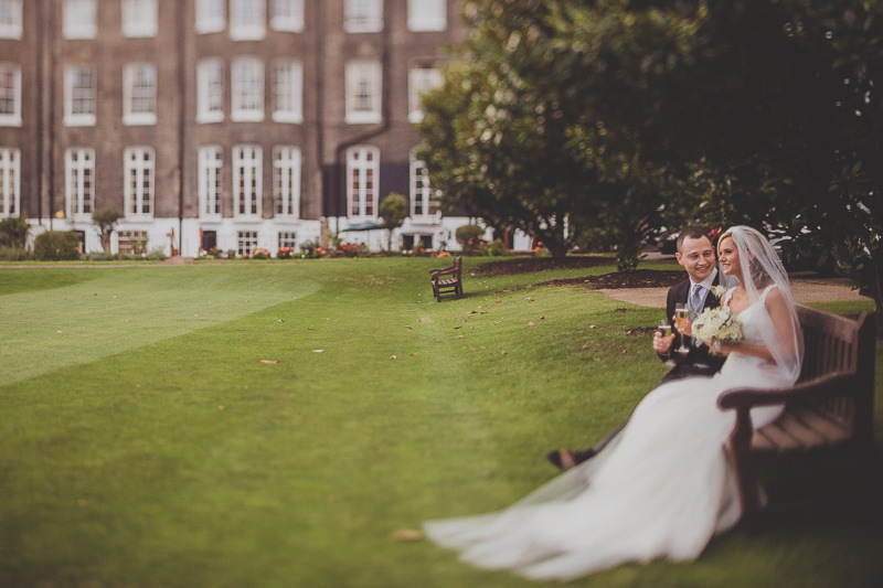 Charming outdoor wedding at Artillery Garden with lush greenery and elegant backdrop.