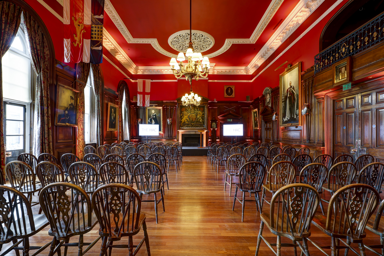 The Long Room at HAC: elegant red walls, ideal for corporate events and presentations.
