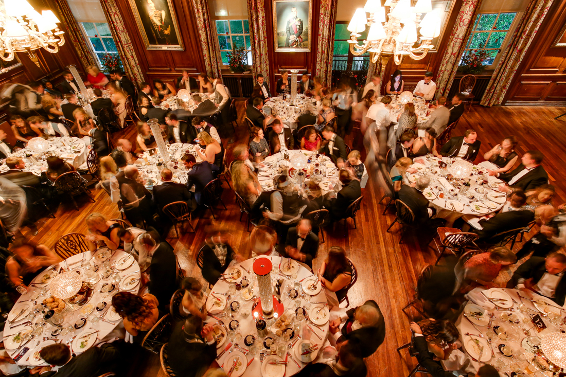 Elegant gala dinner in The Long Room, HAC with fine dining and warm lighting.