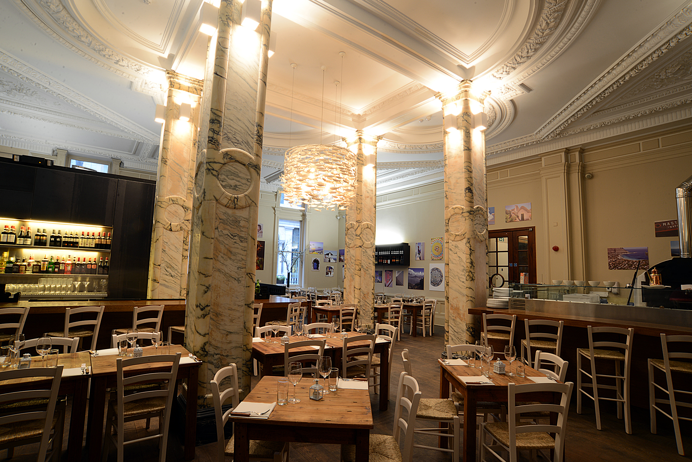 Chandelier Room at The Grand: elegant dining space for intimate meetings and small events.