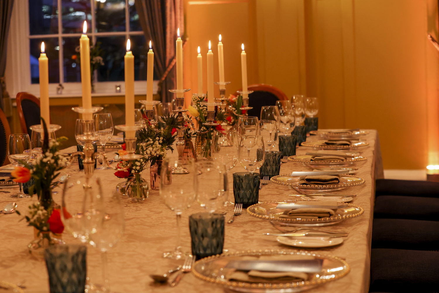 Elegant dining table with floral centerpieces at HAC for gala events.