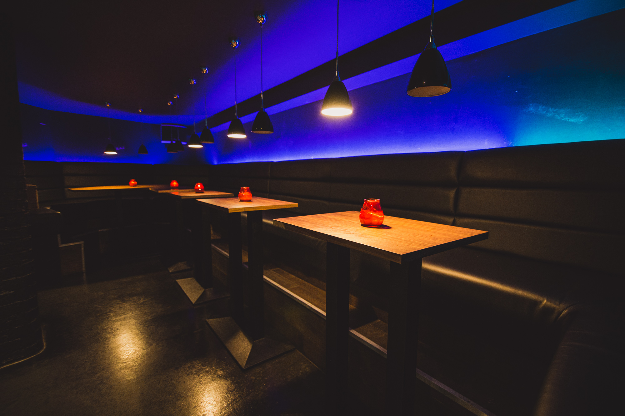 Sleek modern venue with intimate seating, ideal for networking events and cocktail receptions.