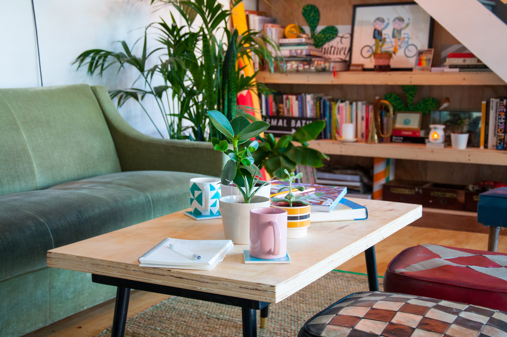 Cozy meeting space with green sofa for informal gatherings and brainstorming sessions.