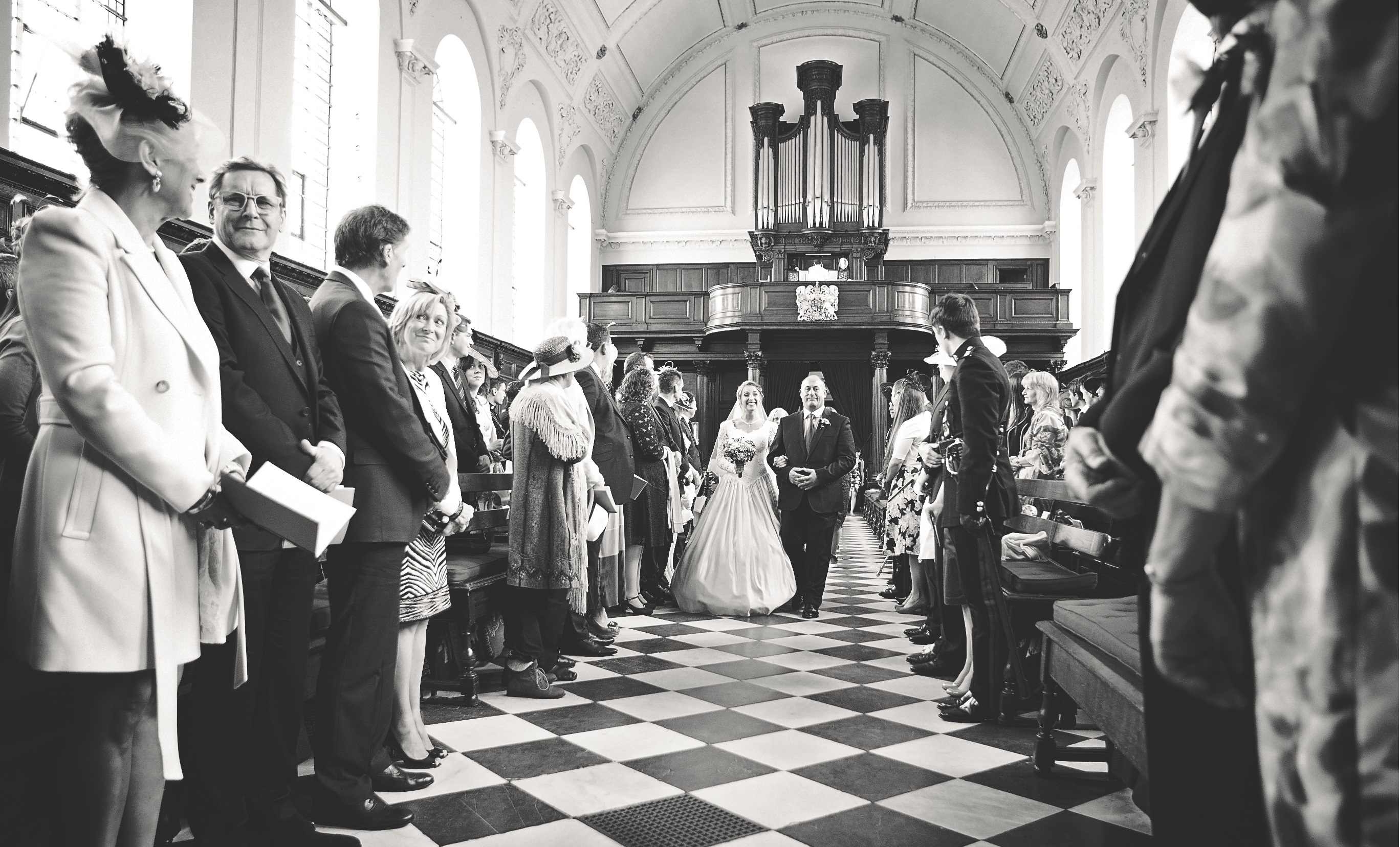 Wren Chapel wedding ceremony with bride and groom in elegant historic venue.