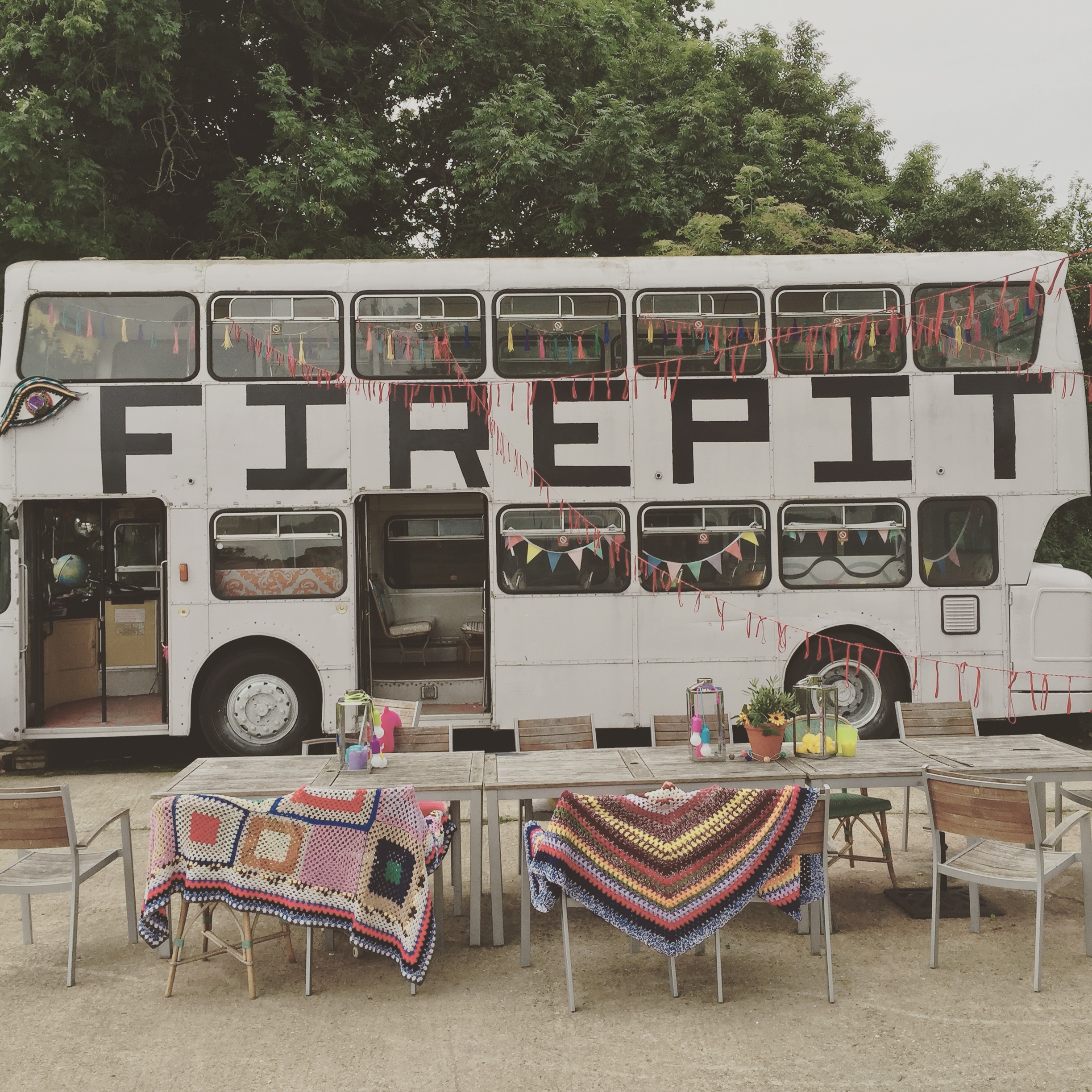 Double-decker bus event space at Camping Meadow, perfect for gatherings and social events.