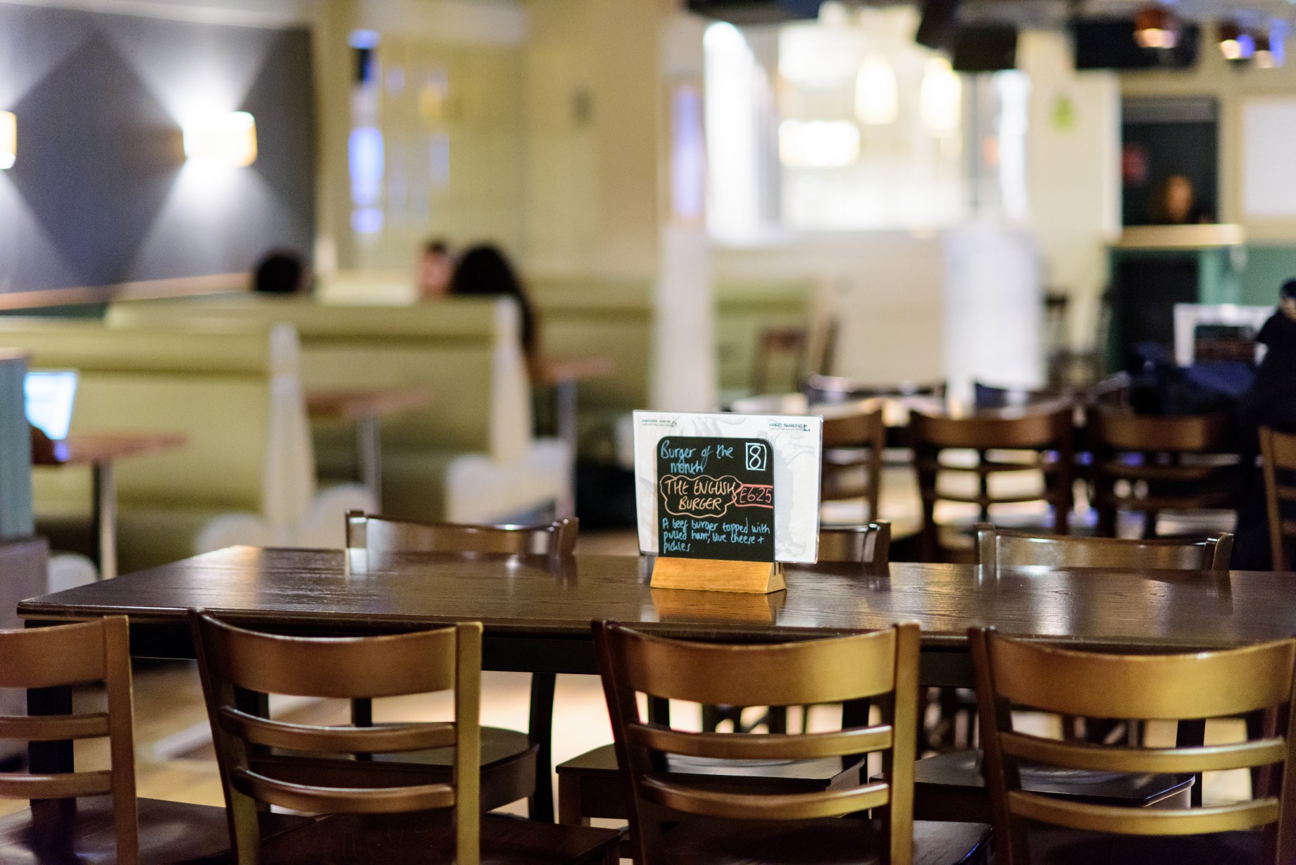 Versatile event space at Griff Inn Bar & Kitchen with wooden seating for networking events.