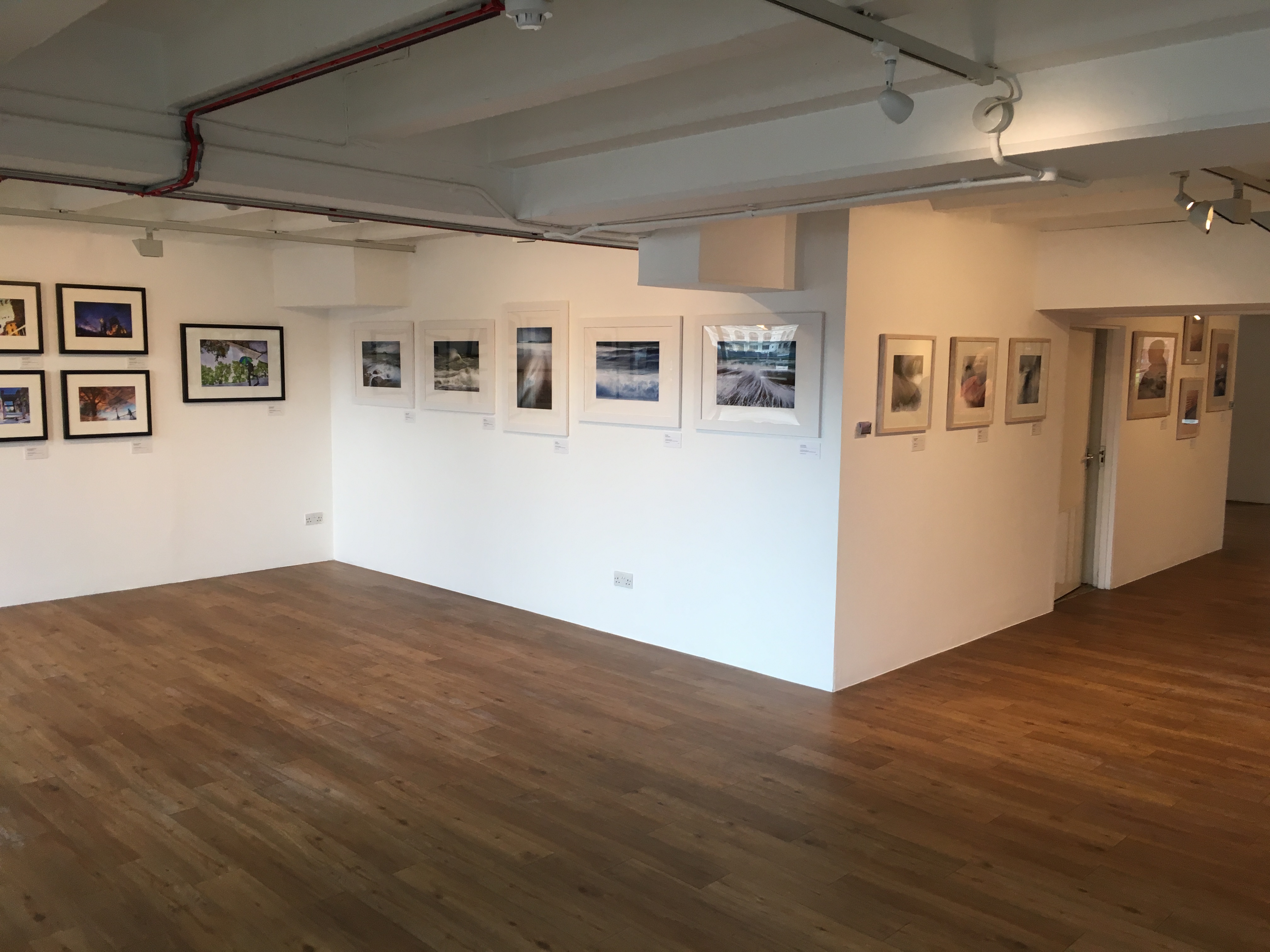 Gallery@OXO Tower with framed photographs, ideal for art exhibitions and corporate events.