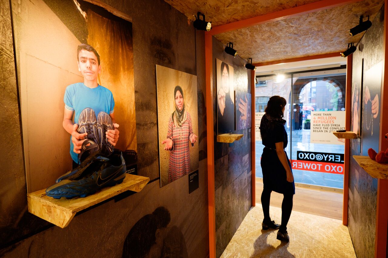 Gallery@OXO exhibition space with large portraits for storytelling events.
