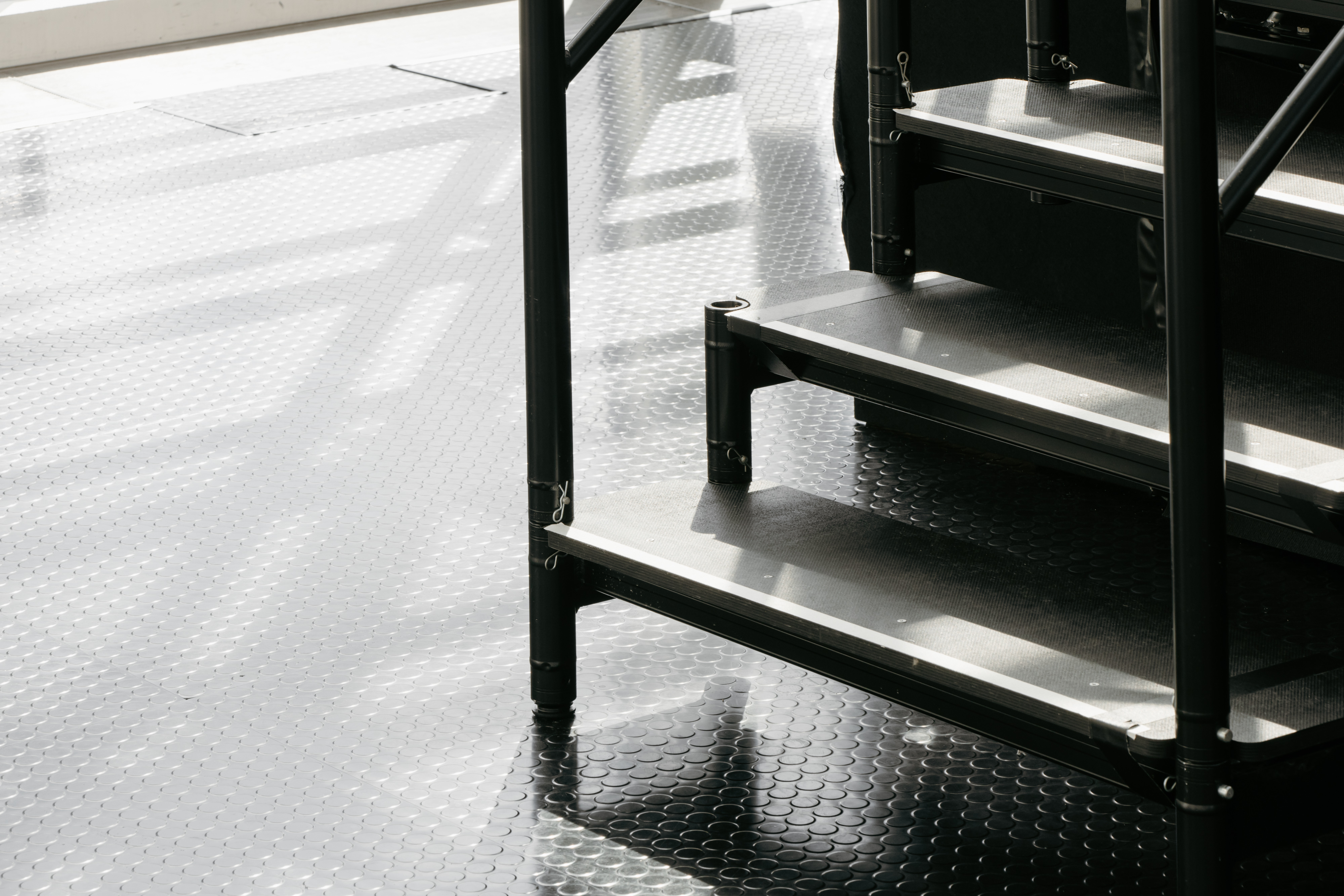 Sleek metal staircase in The Pelligon, ideal for upscale corporate events and gatherings.