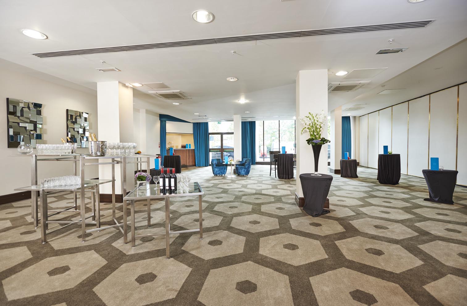 Battersea Room at Hilton London Olympia, modern decor, ideal for meetings and events.