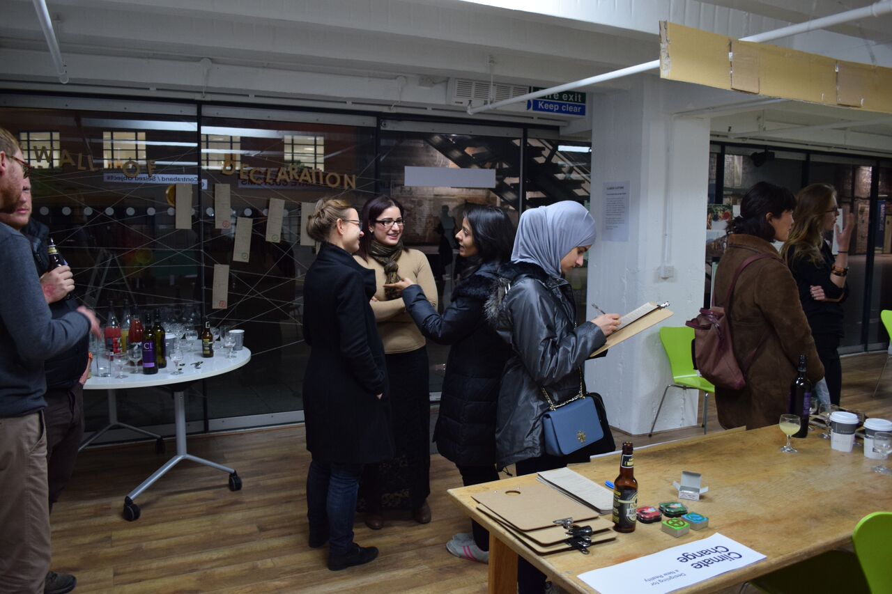 Vibrant networking event at OXO Tower with diverse attendees and casual seating.