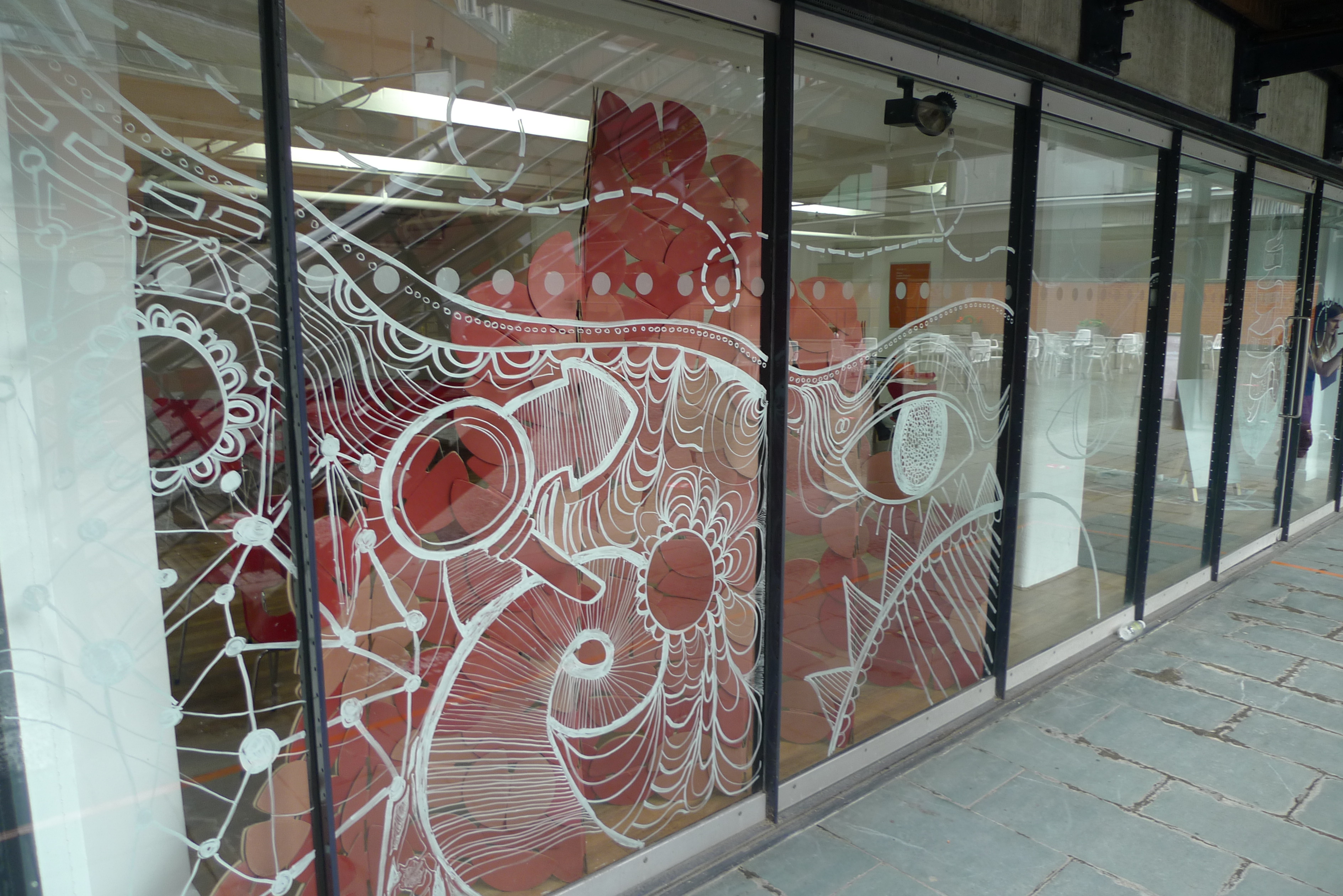 G11 OXO Tower: Glass facade meeting space with artistic design for events and creativity.