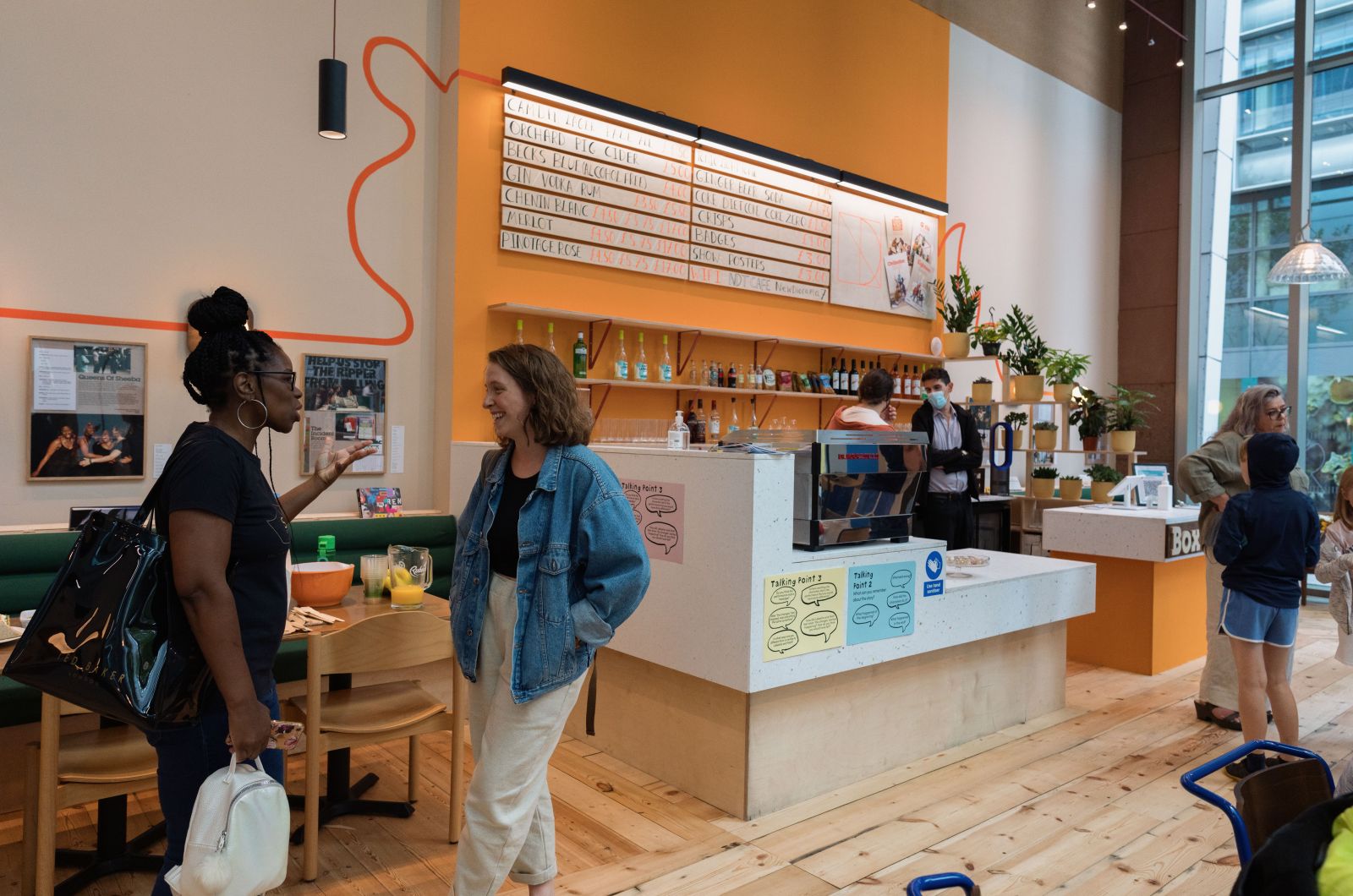 New Diorama Theatre café space for networking events with vibrant colors and seating.