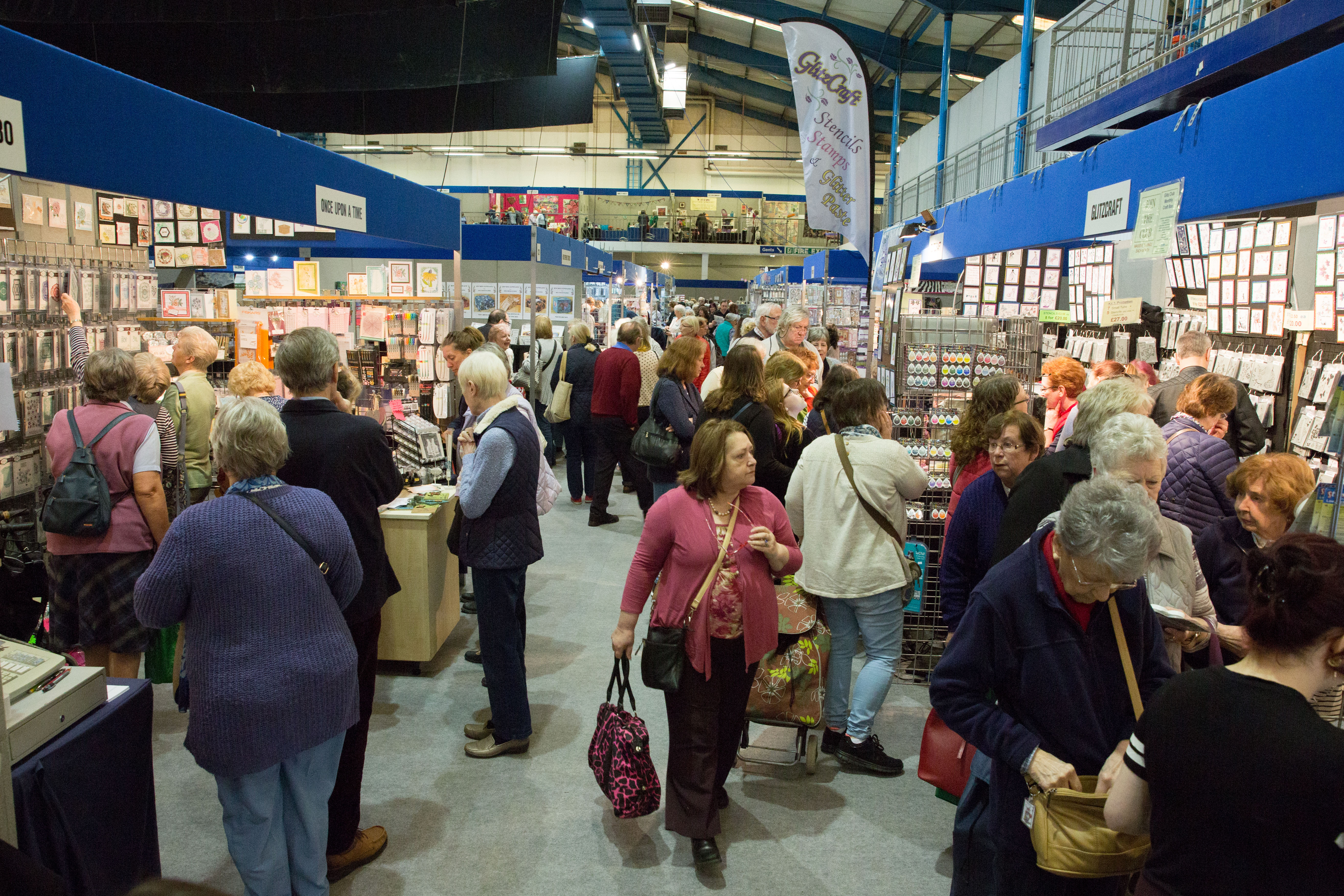 Showering Pavilion at Bath & West Showground, bustling trade show with vendor displays.