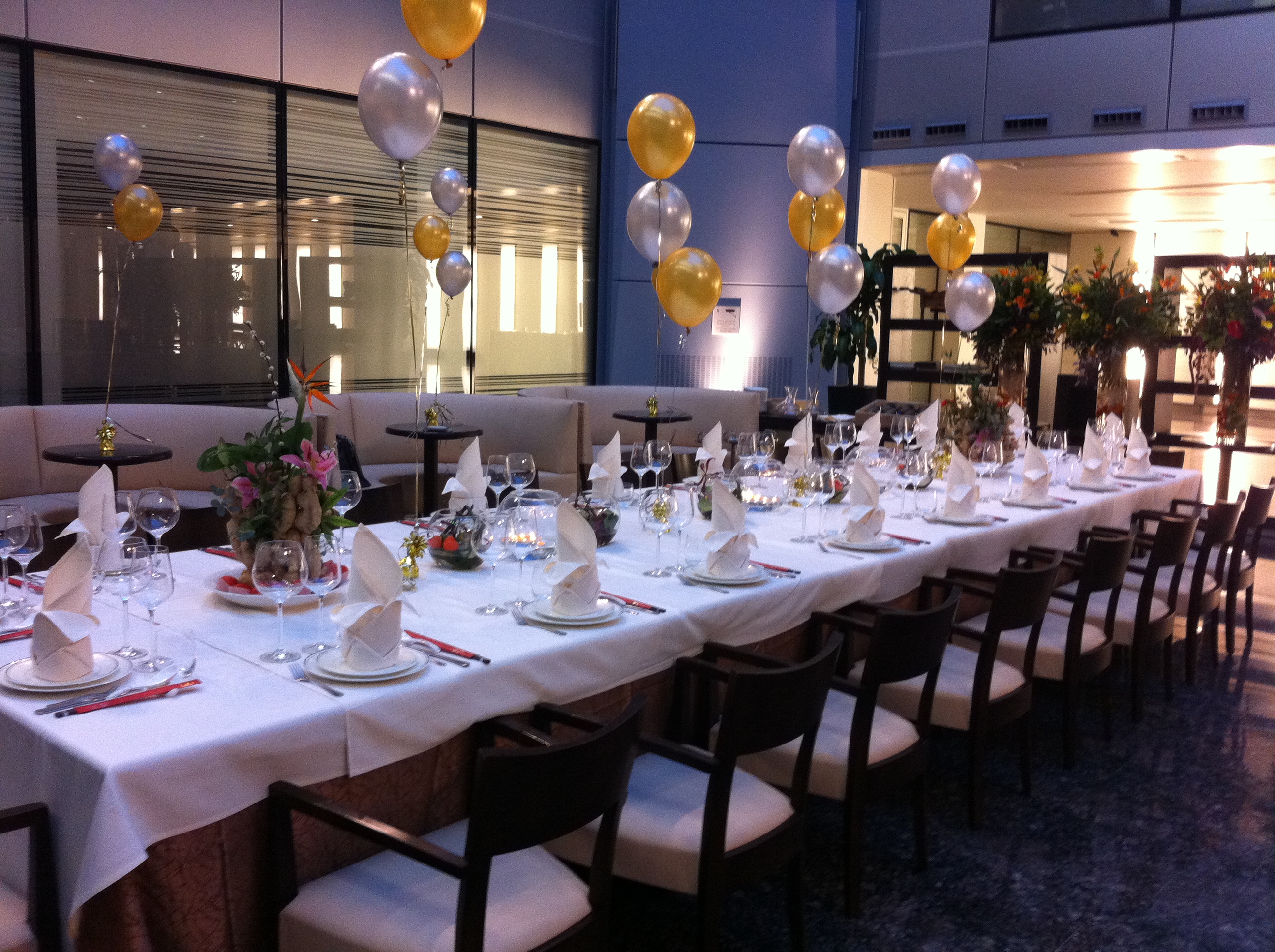 Elegant banquet table with floral centerpieces for weddings and corporate events.