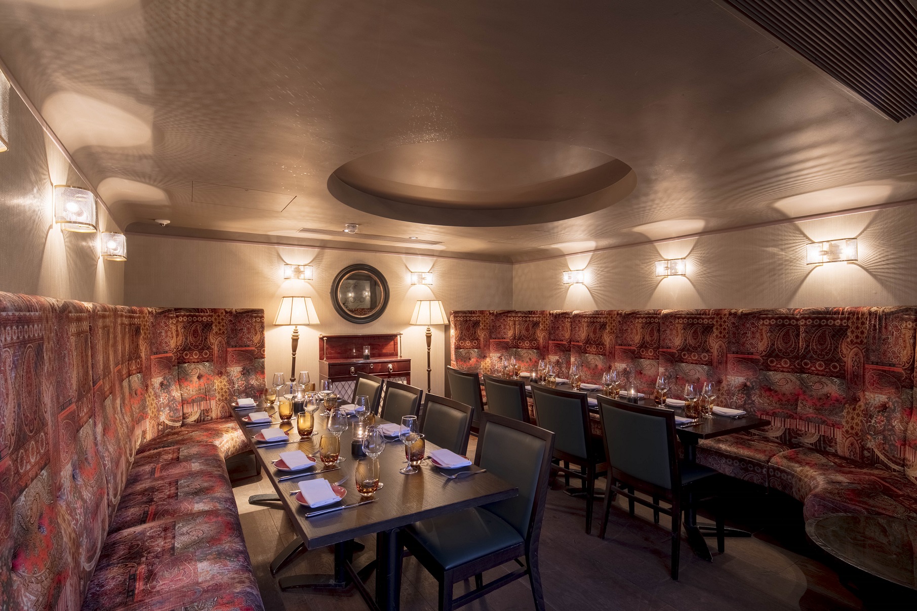 Intimate dining space with cozy booths for private events and corporate dinners.