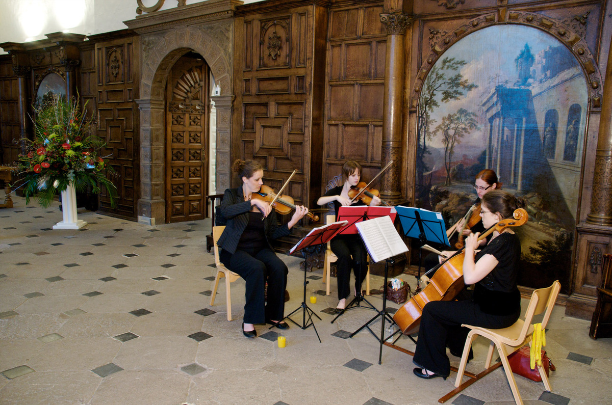 String quartet performing in elegant Aston Hall, perfect for weddings and corporate events.