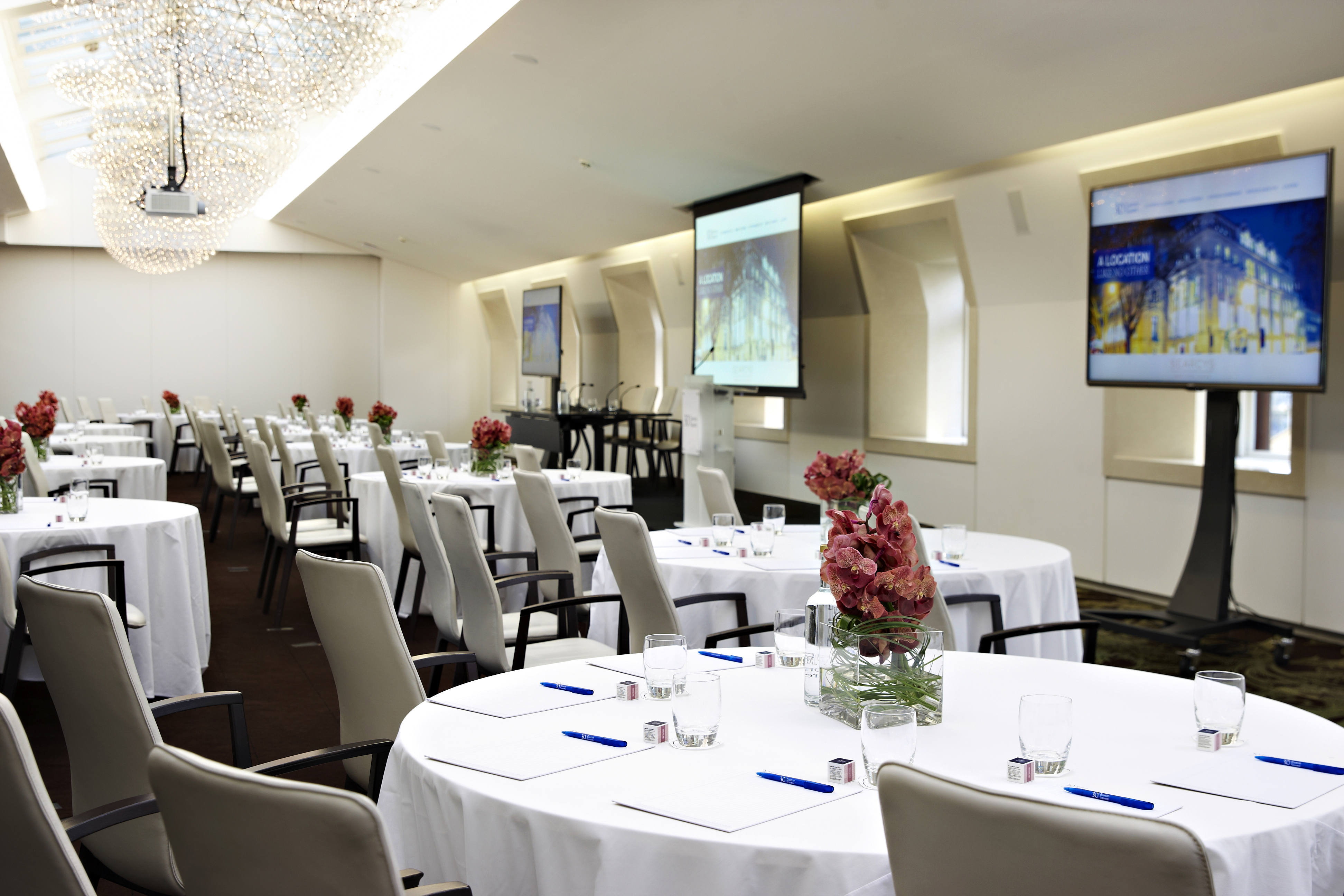 State Rooms & Rooftop Terrace with elegant round tables for corporate meetings.