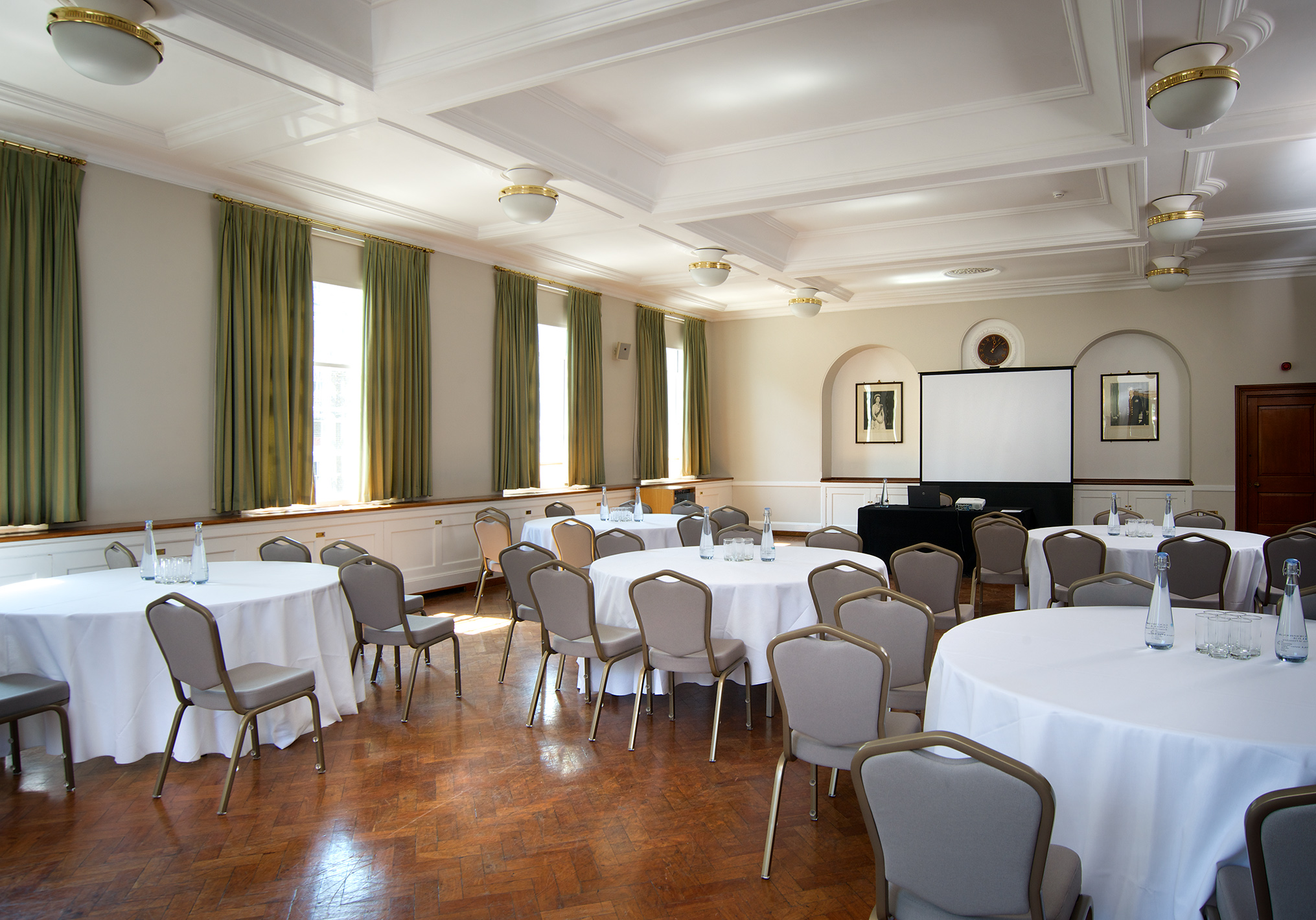 London House Large Common Room with round tables, ideal for workshops and conferences.