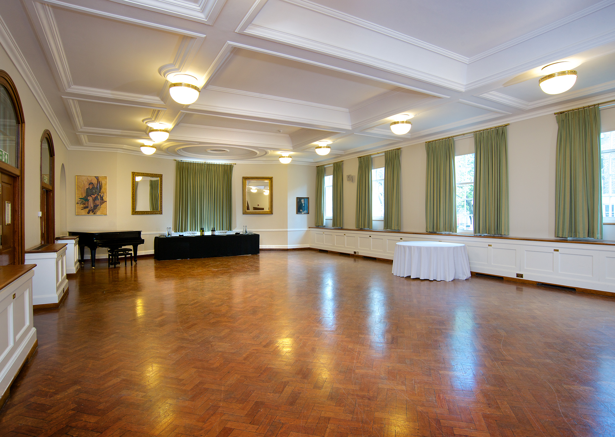 Spacious London House event room with grand piano, ideal for meetings and receptions.