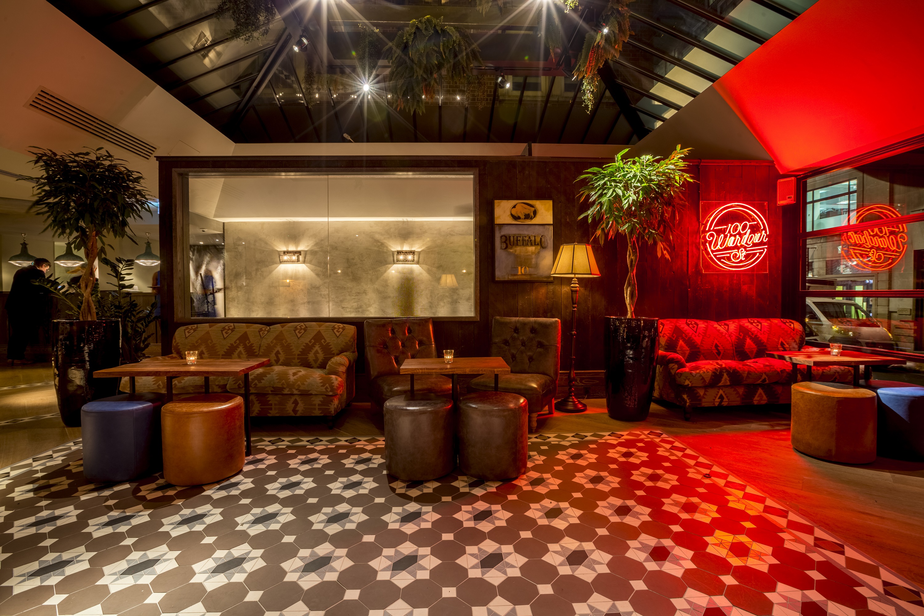 Stylish lounge at 100 Wardour Street, ideal for networking events and informal meetings.