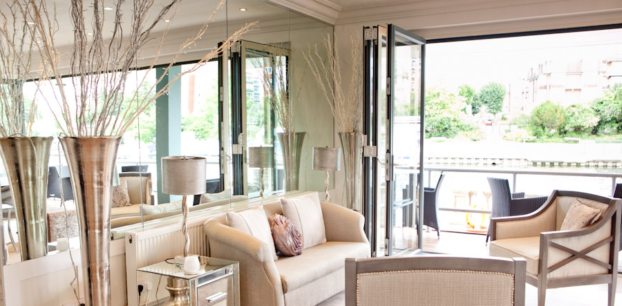 Modern event space with large windows at Ravens Ait Island for networking and gatherings.