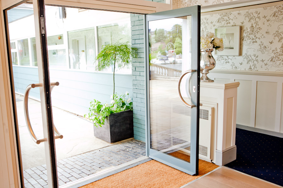 Welcoming reception entrance with glass doors at Ravens Ait Island for events and meetings.