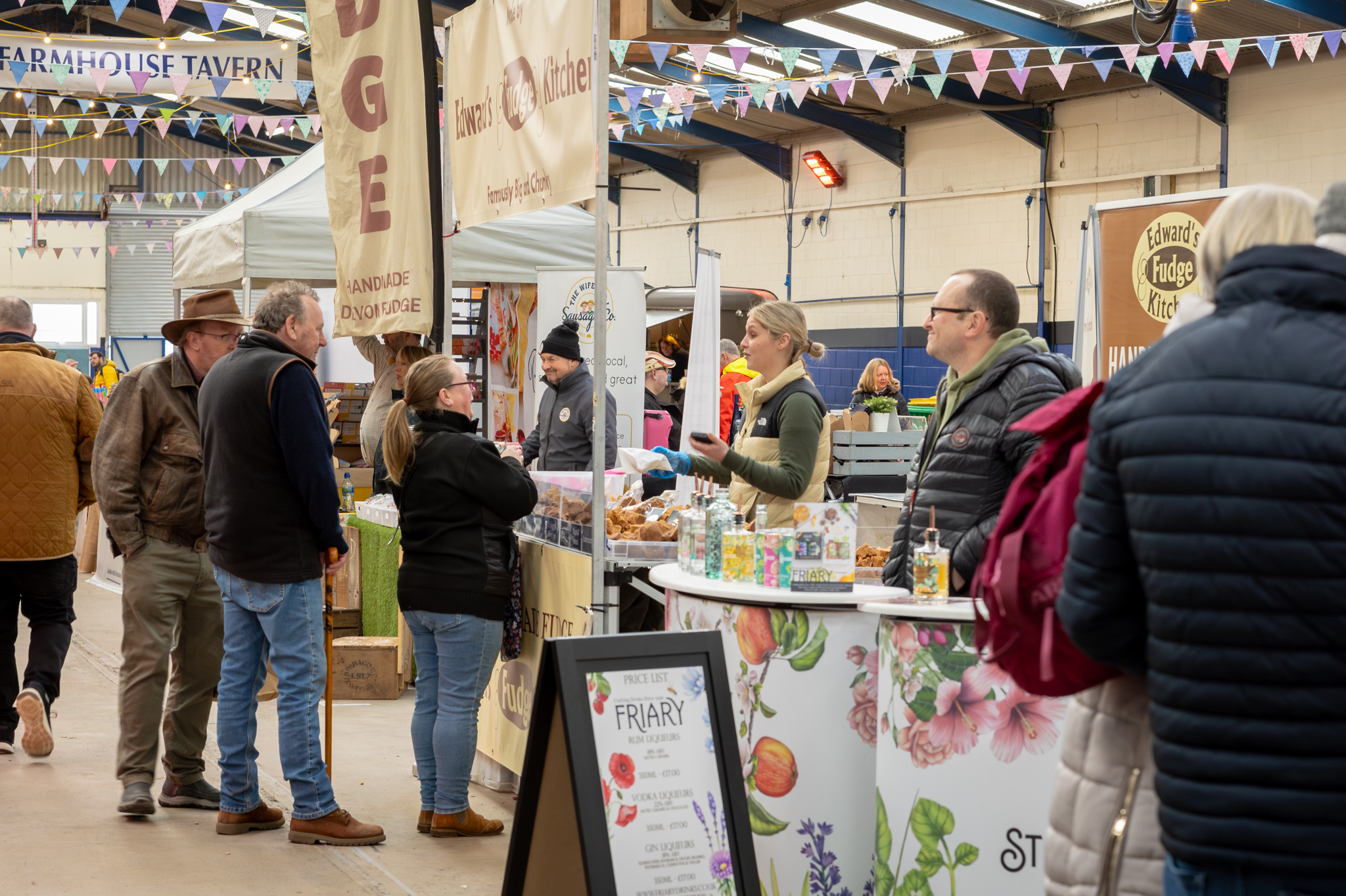 Vibrant market scene at Bath & West Showground, showcasing community event and trade show.