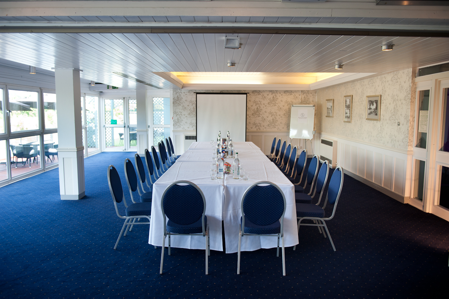 Thames Suite meeting room with elegant table setup for professional events on Ravens Ait Island.